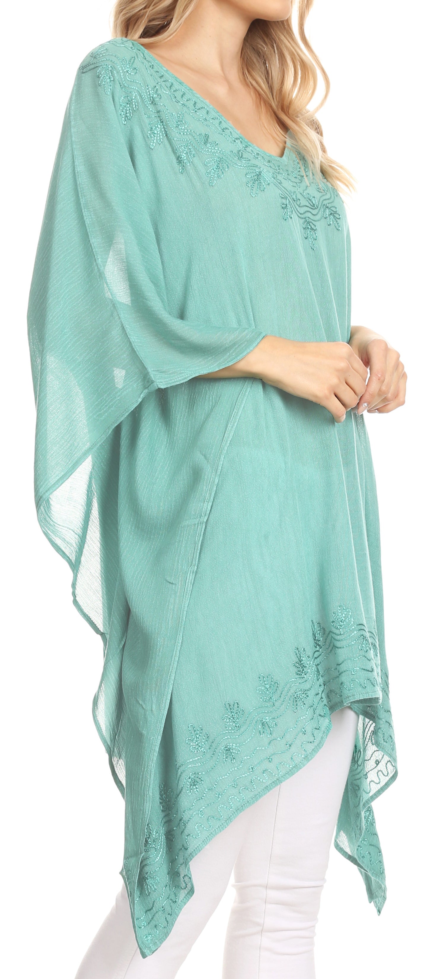 Mint green lace top worn by a model on a white background