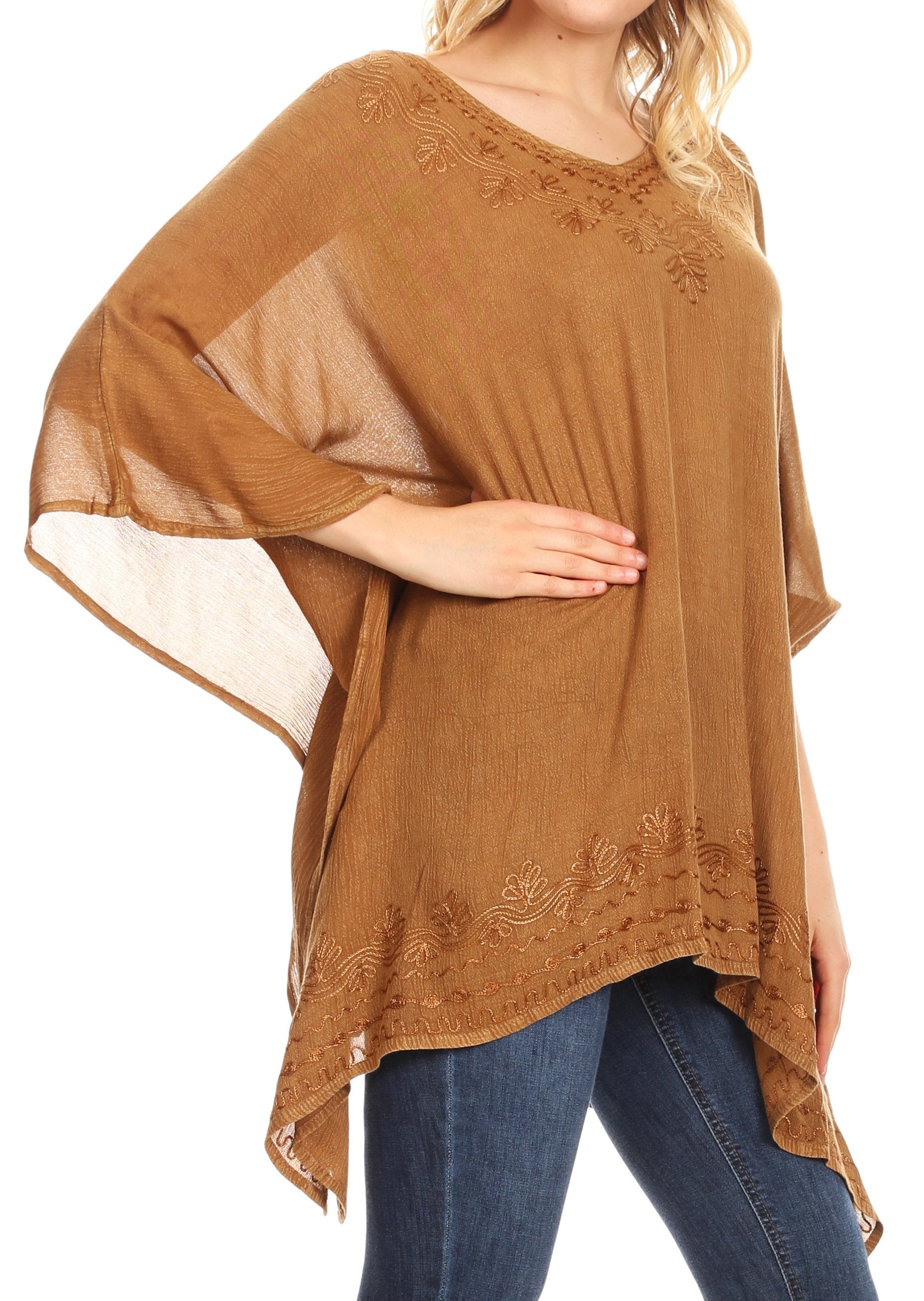 Brown embroidered top worn by a person on a white background