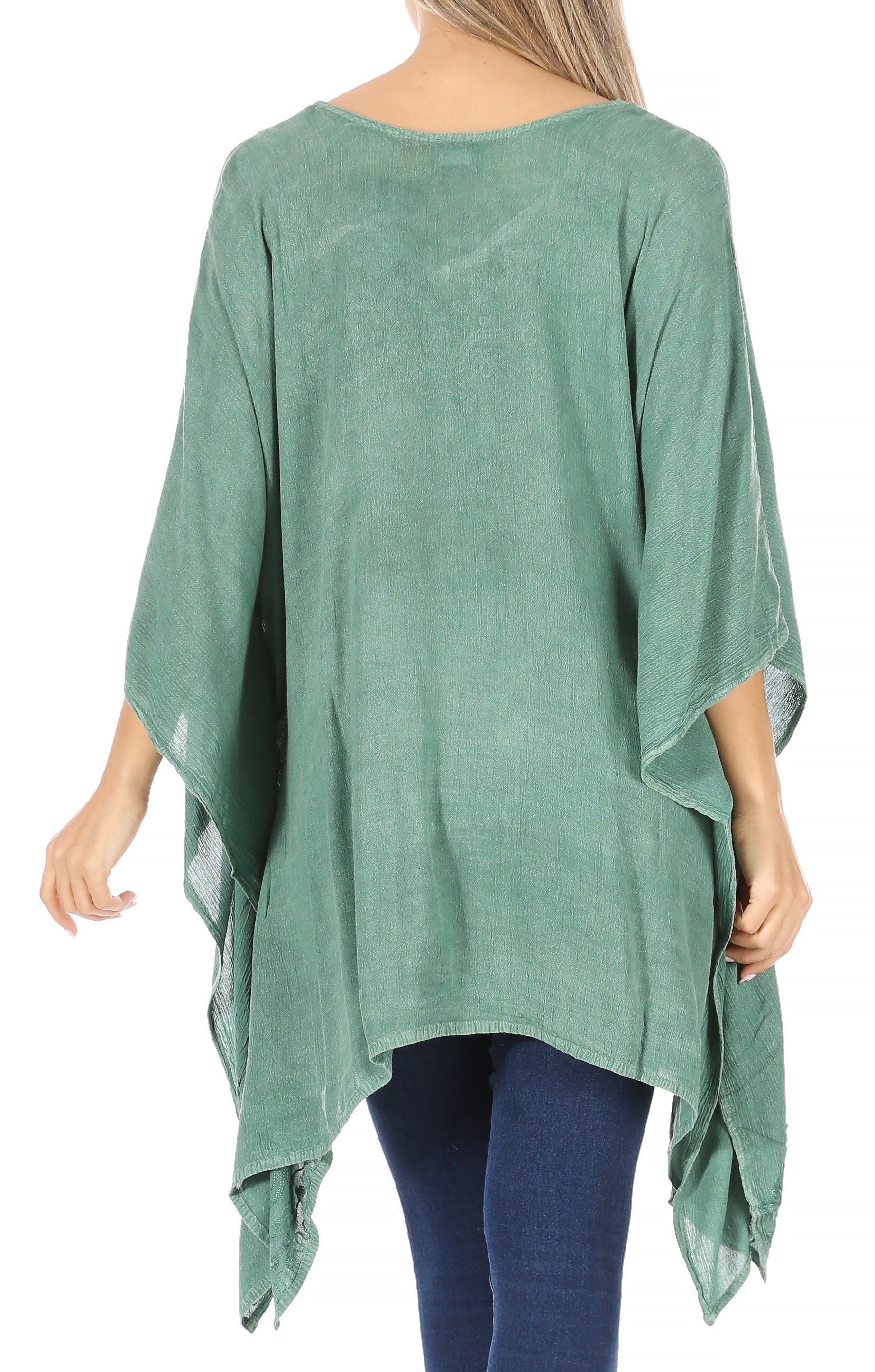 Green poncho worn by a person on a white background