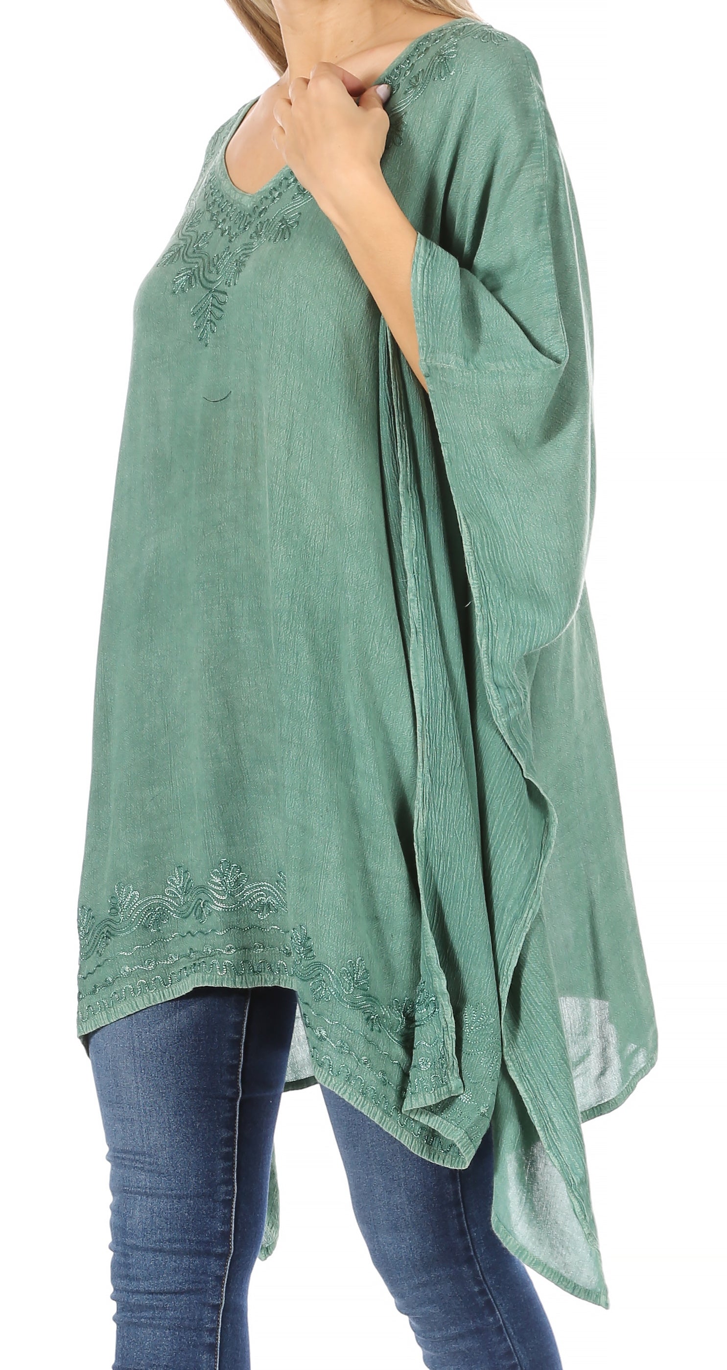 Green oversized shirt with lace details worn by a person on a white background