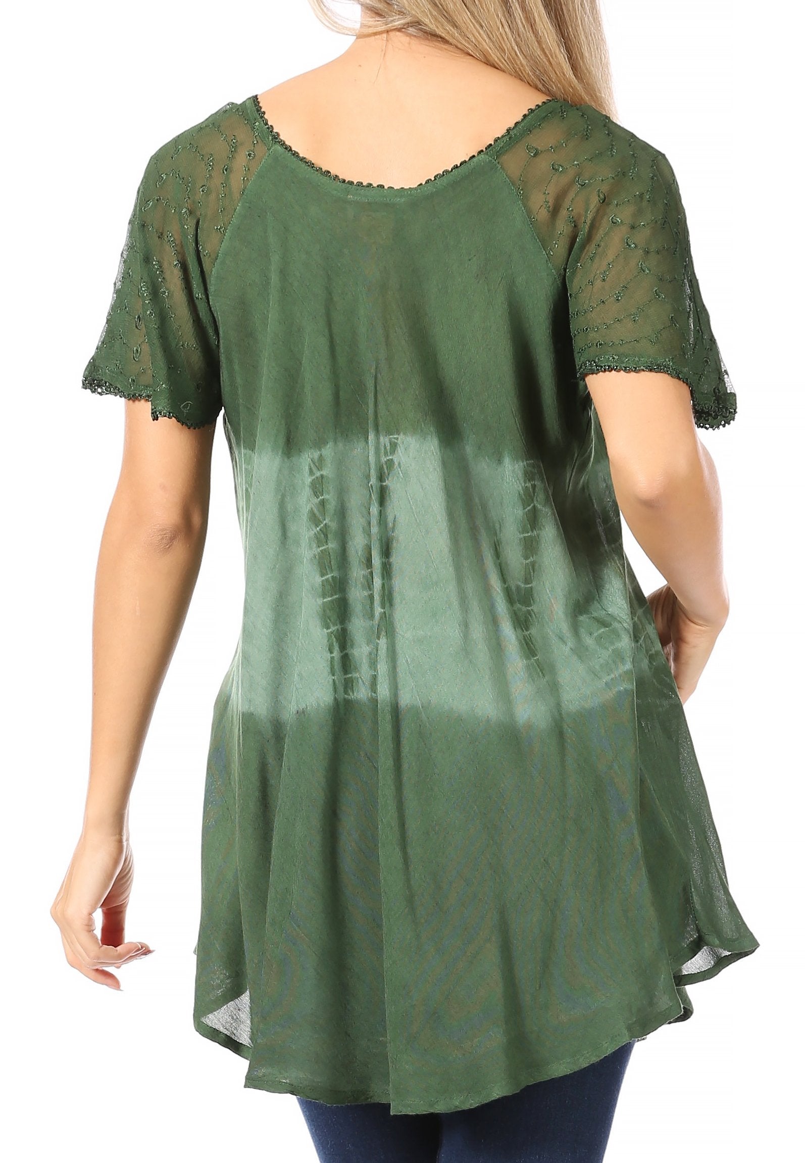 Green lace-trimmed dress worn by a person on a white background