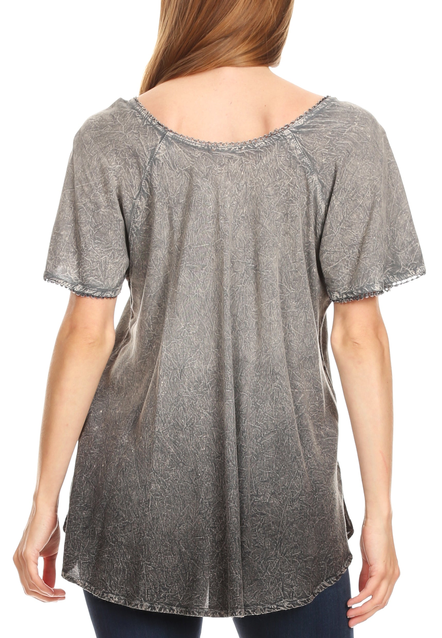 Woman wearing a gray patterned t-shirt on a white background