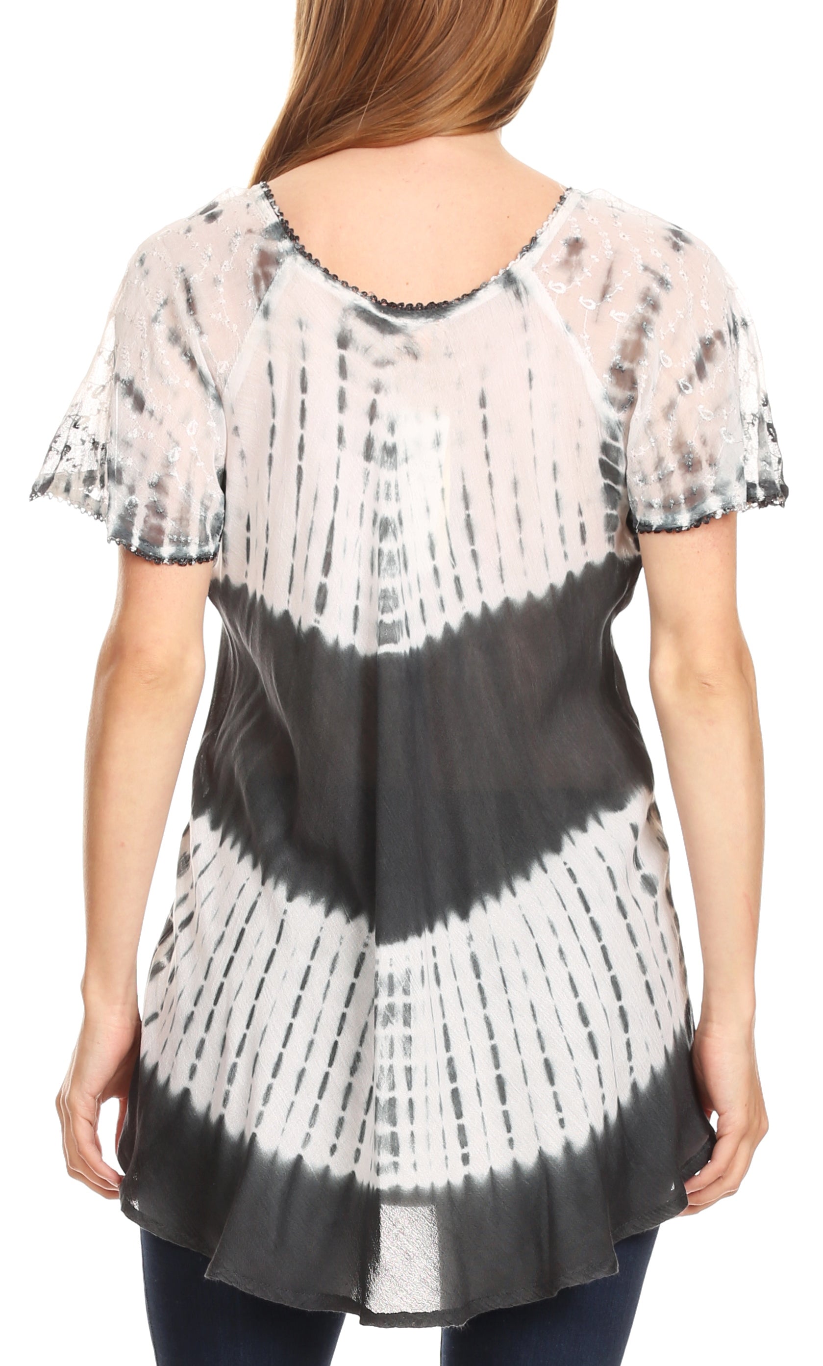 Person wearing a black and white tie-dye shirt on a white background