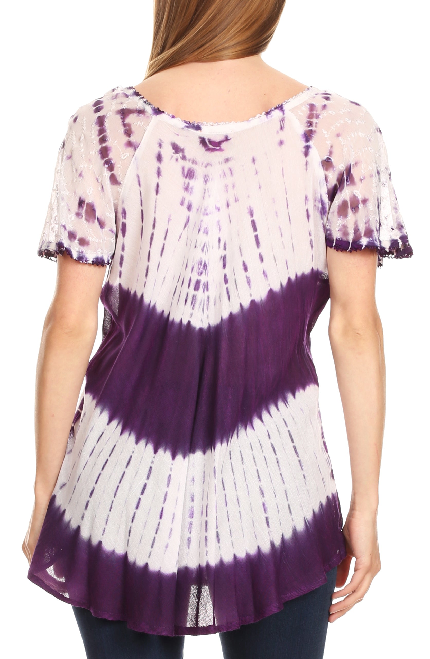 Woman wearing a purple and white tie-dye shirt on a plain background