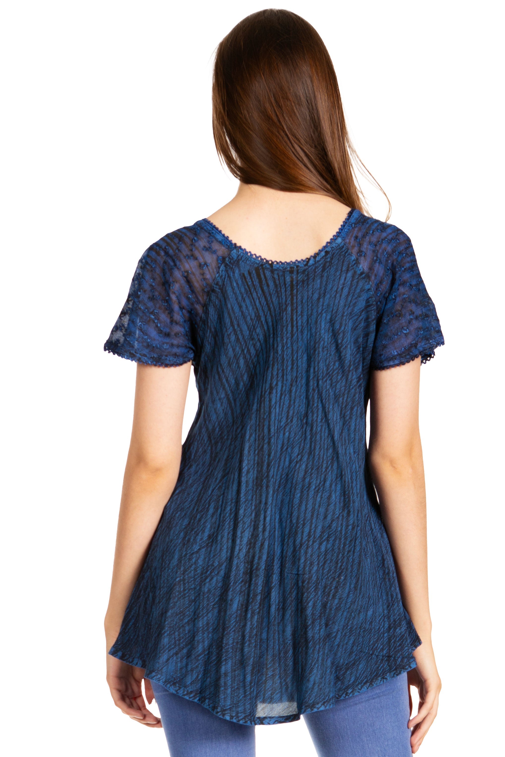 Woman wearing a blue lace top on a white background