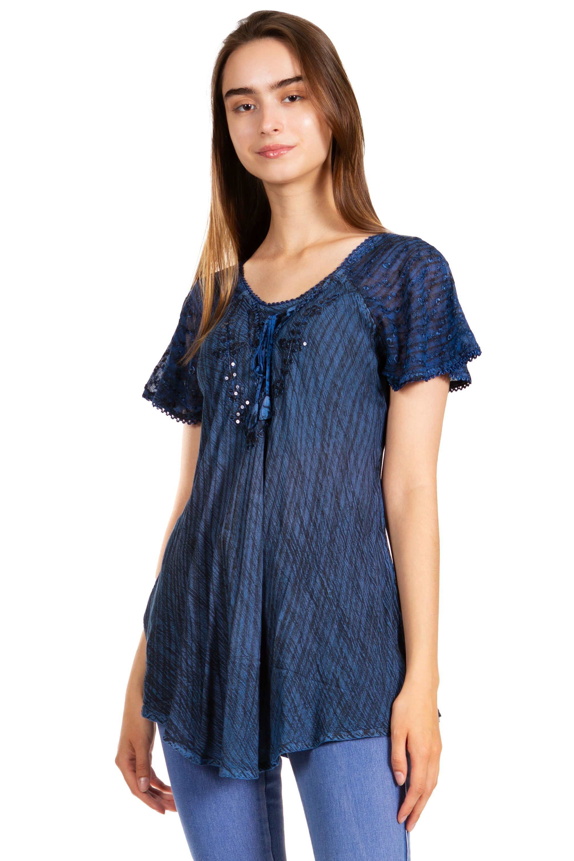 Woman wearing a blue patterned top on a white background
