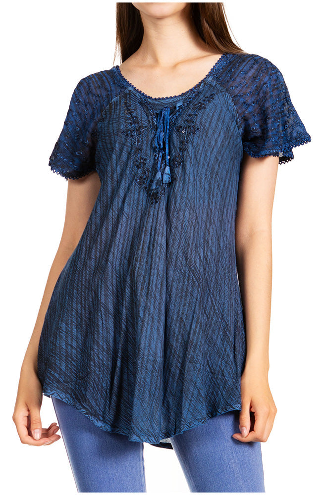 Blue lace top worn by a model on a white background