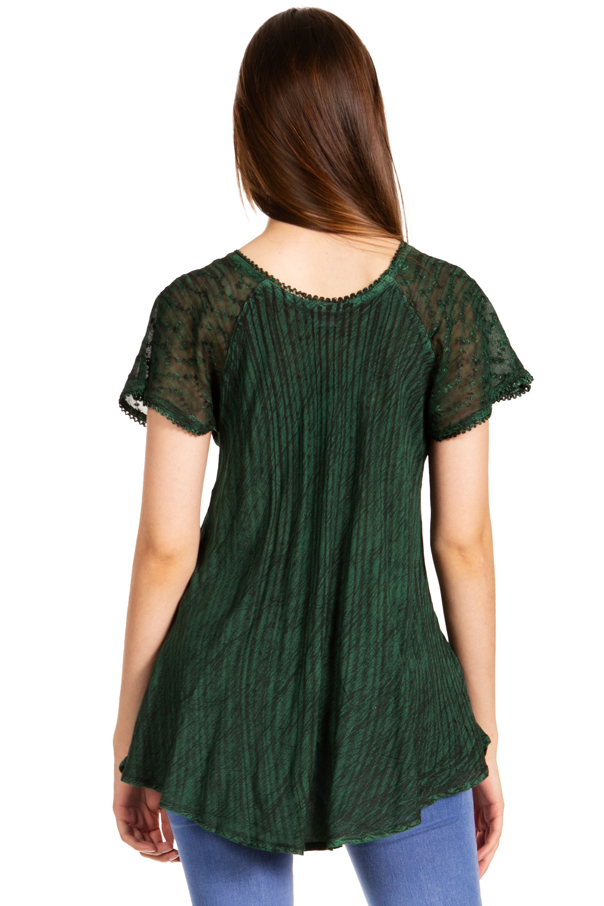 Green textured top worn by a person on a white background