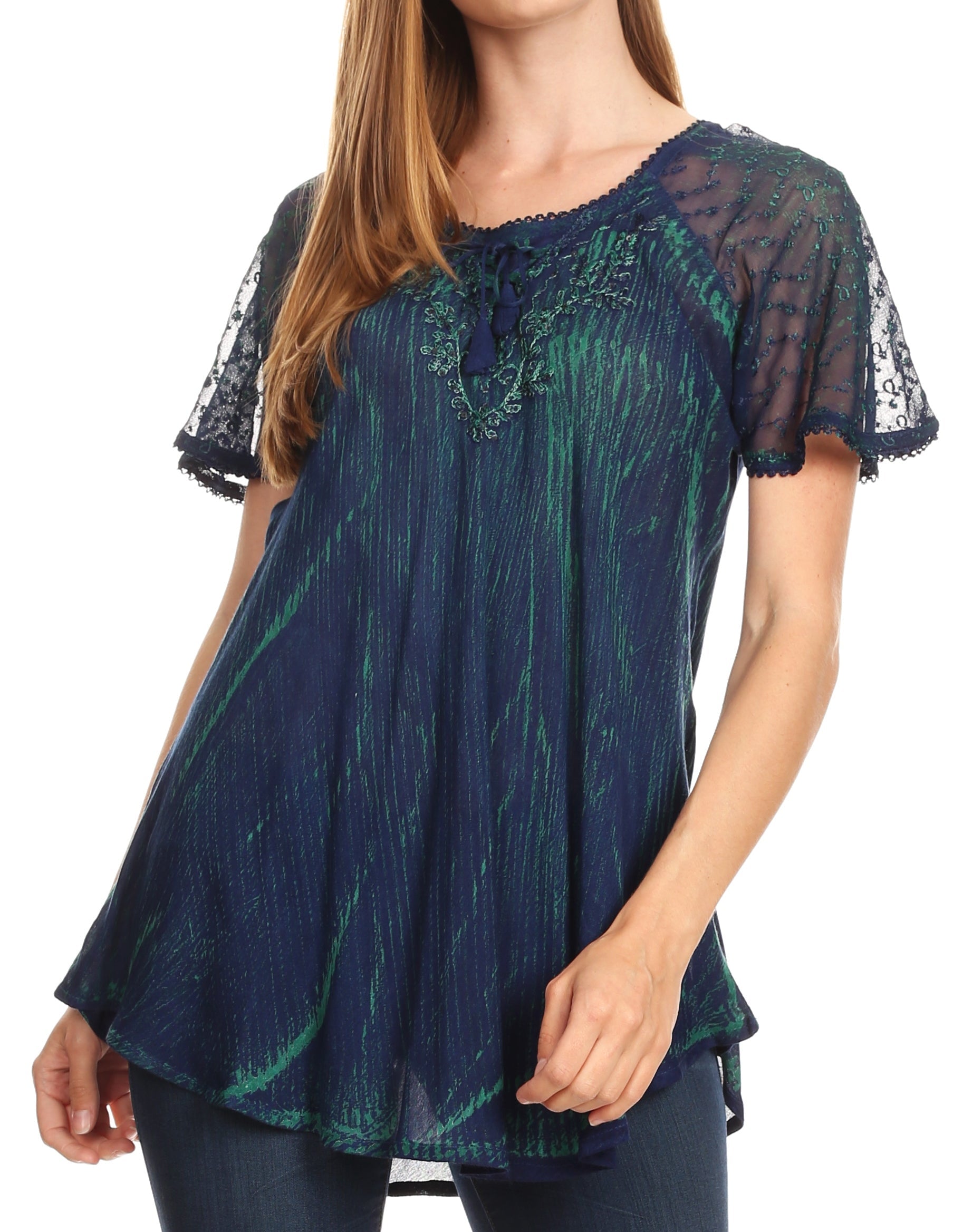 Woman wearing a blue and green patterned blouse with lace sleeves on a white background