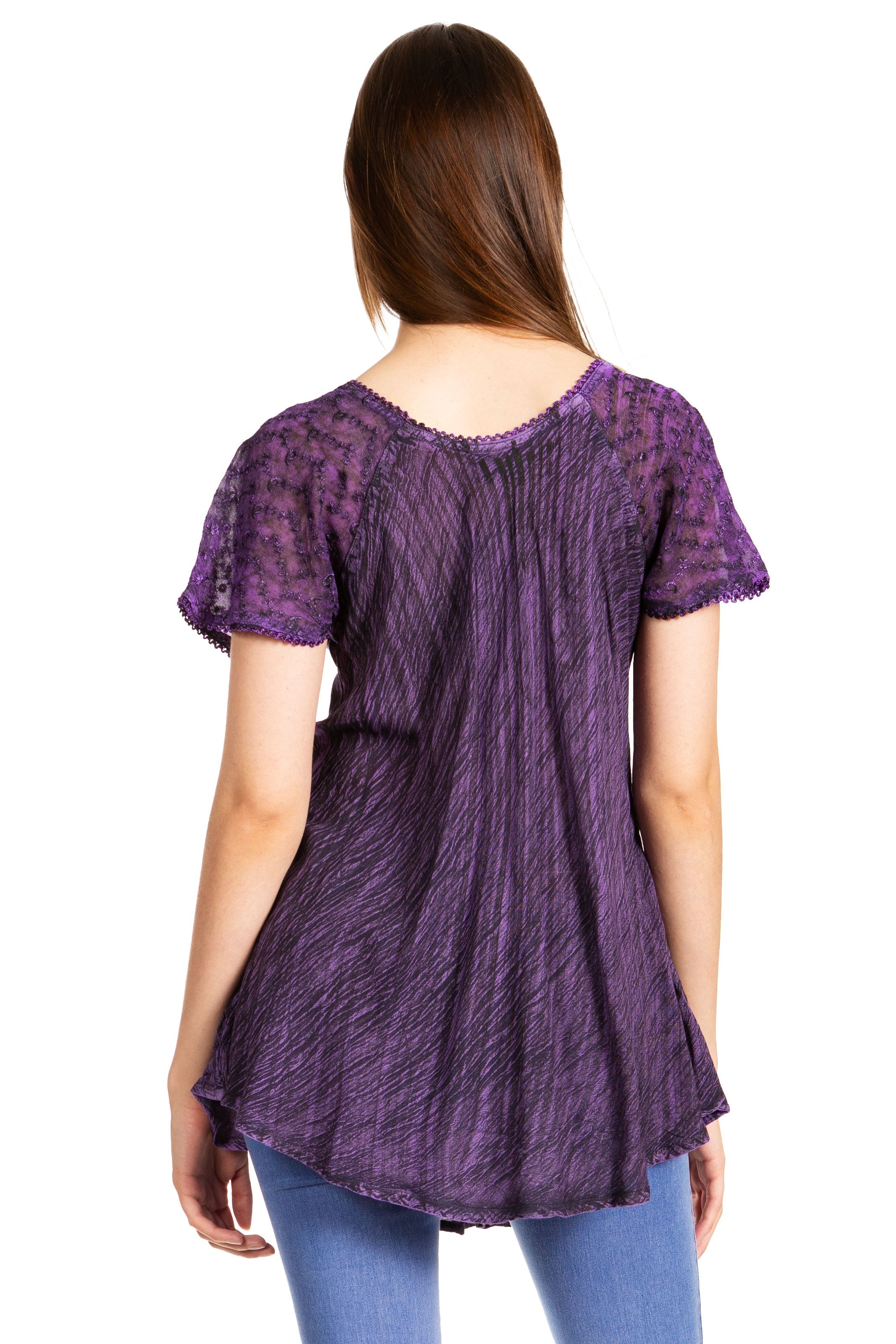 Purple textured top worn by a person on a white background
