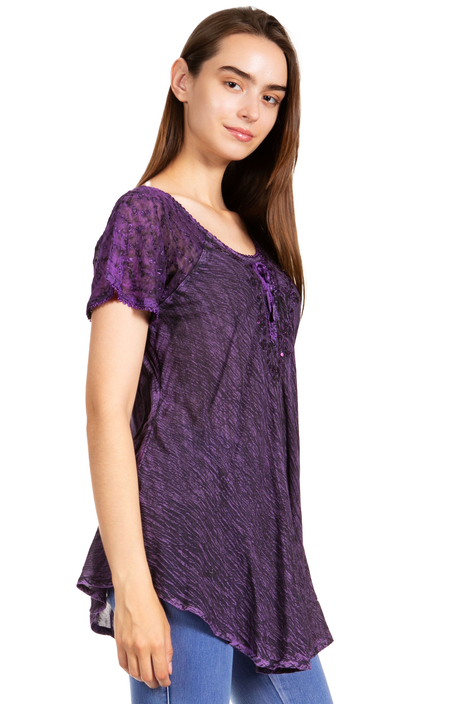 Woman wearing a purple lace top on a white background