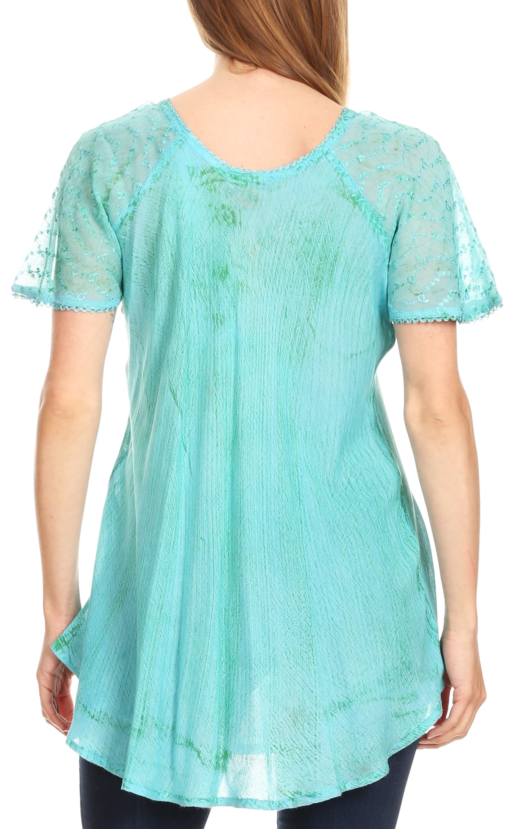 Light blue lace top worn by a person on a white background