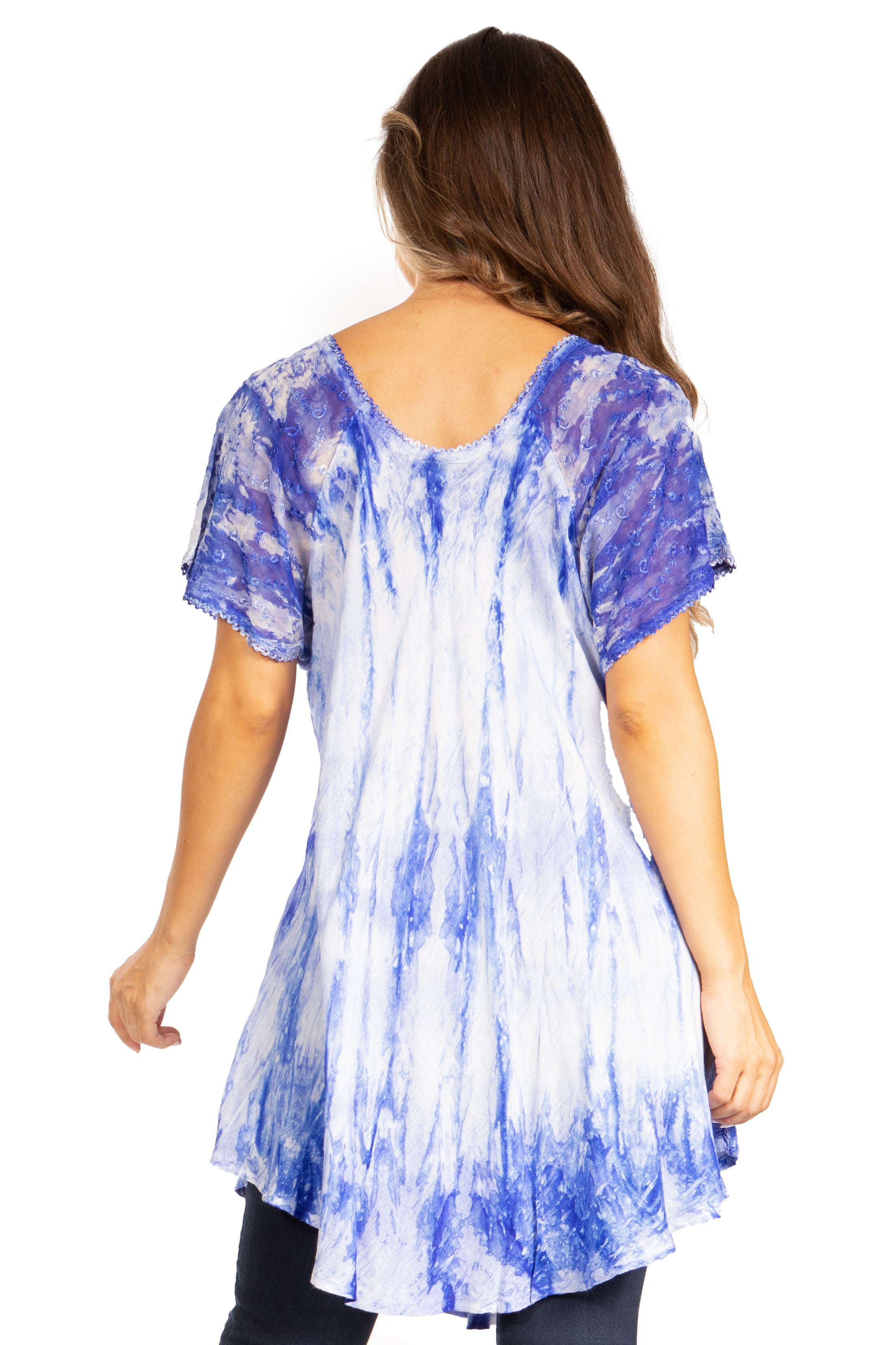 Woman wearing a blue and white tie-dye tunic on a white background
