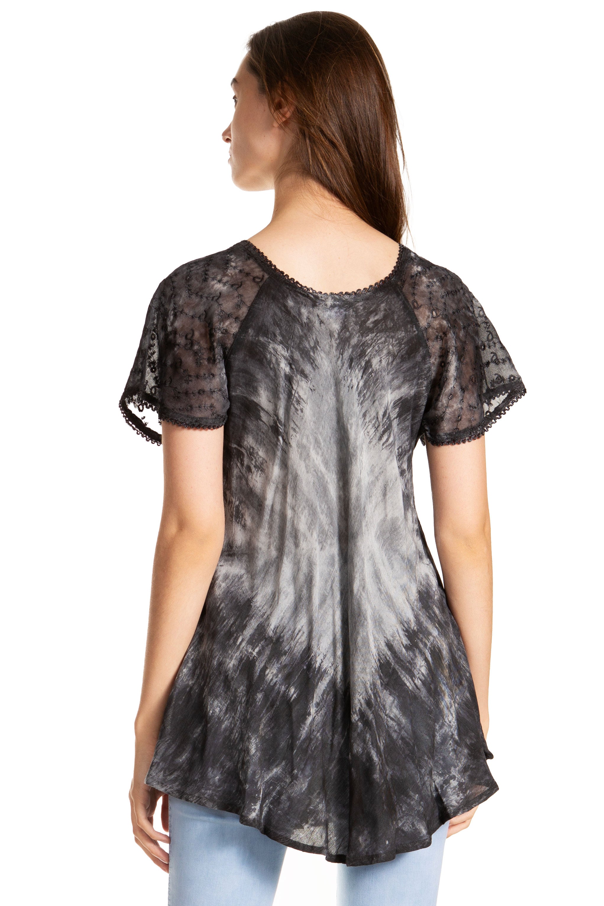 Woman wearing a black and gray tie-dye shirt on a white background