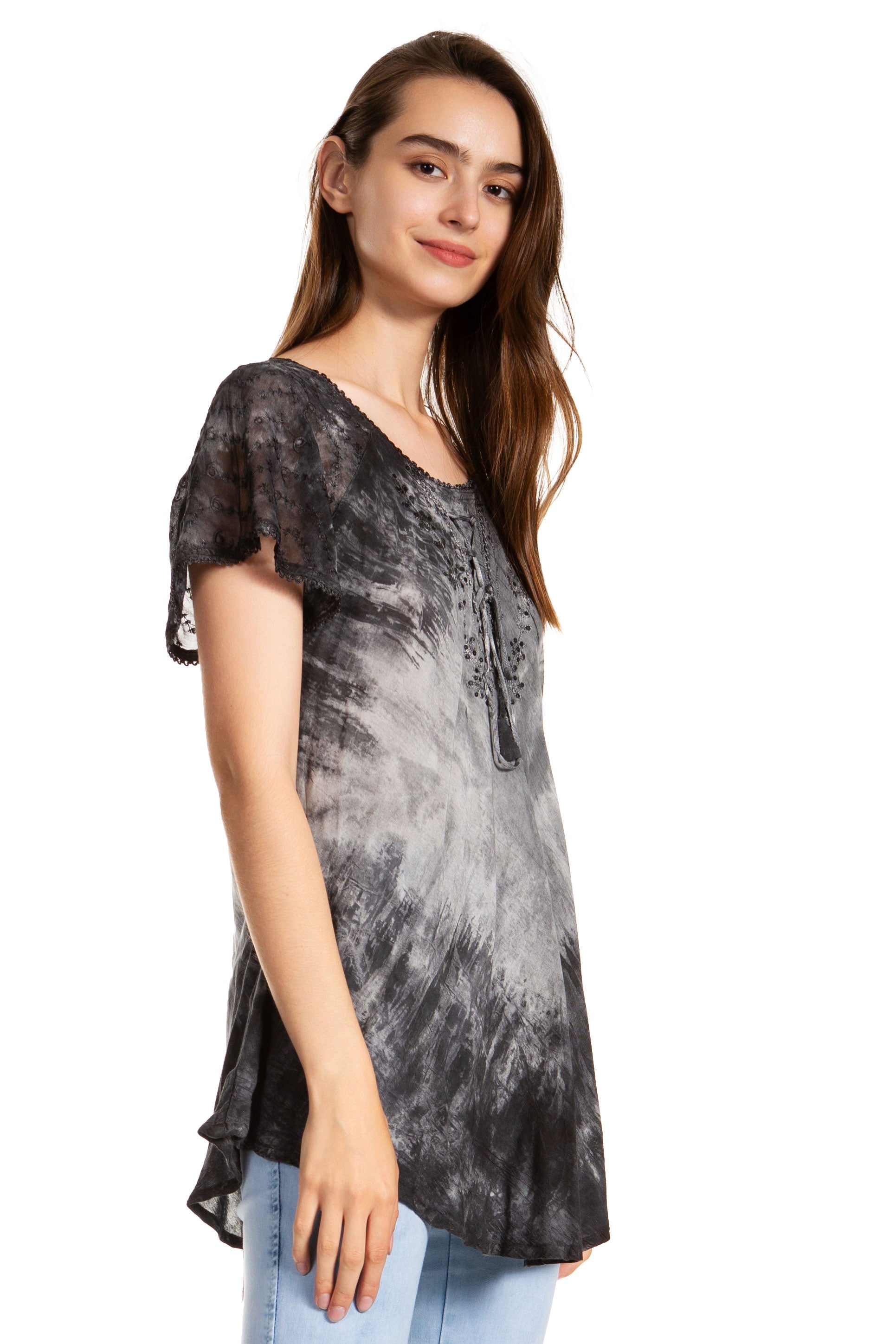 Woman wearing a black and gray tie-dye shirt on a white background