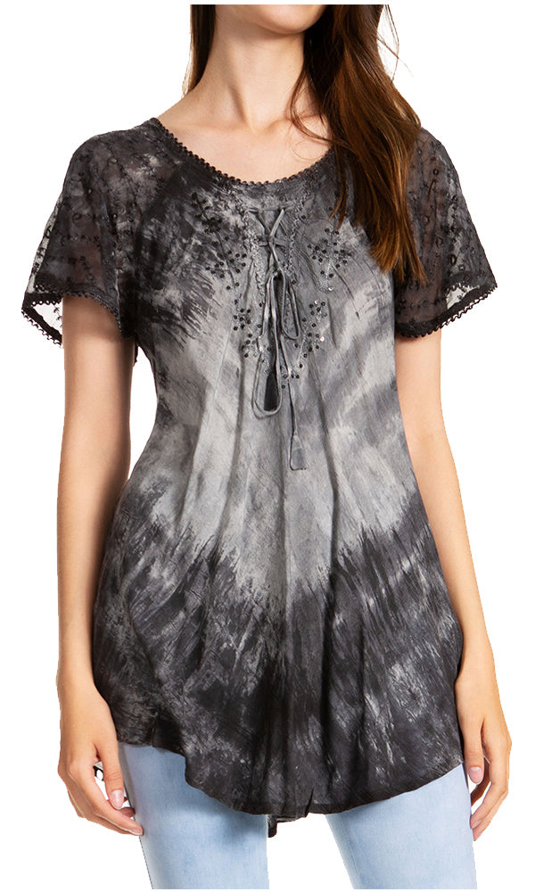Woman wearing a black and gray tie-dye blouse with lace sleeves on a white background