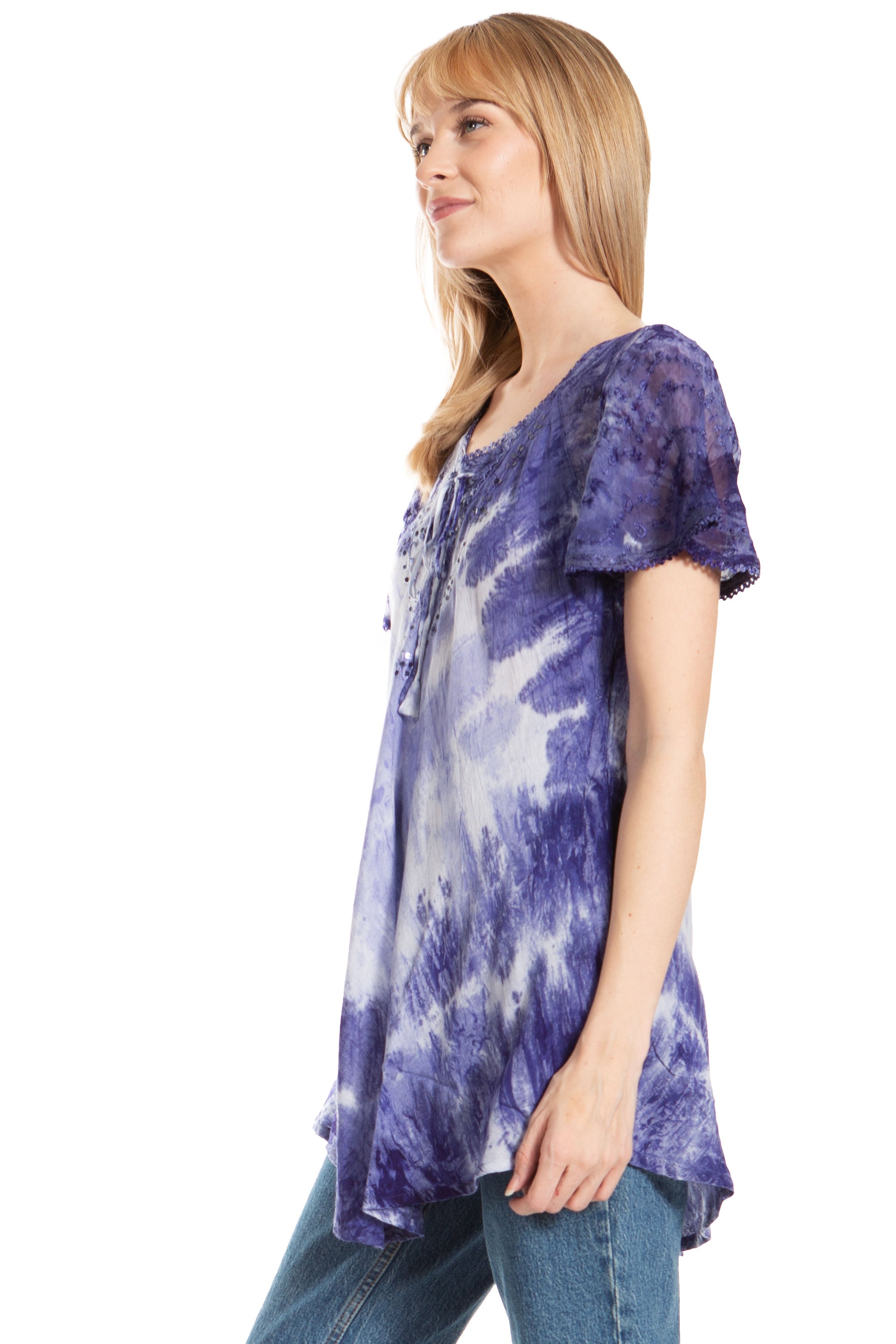 Woman wearing a tie-dye shirt on a white background