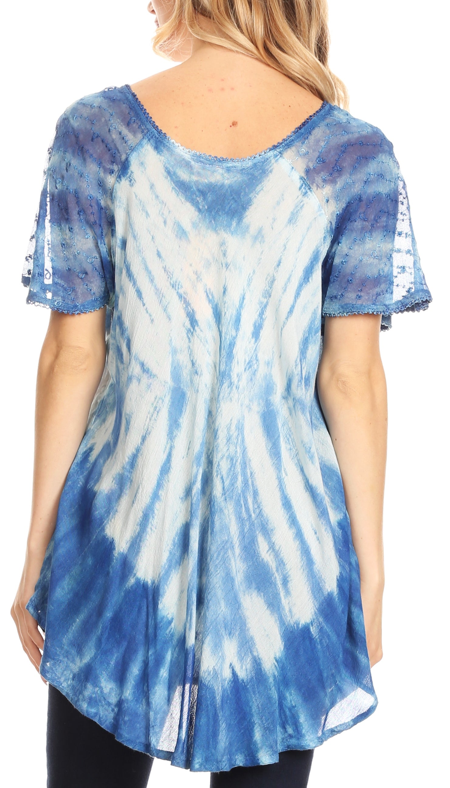 Blue and white tie-dye tunic worn by a person on a plain background