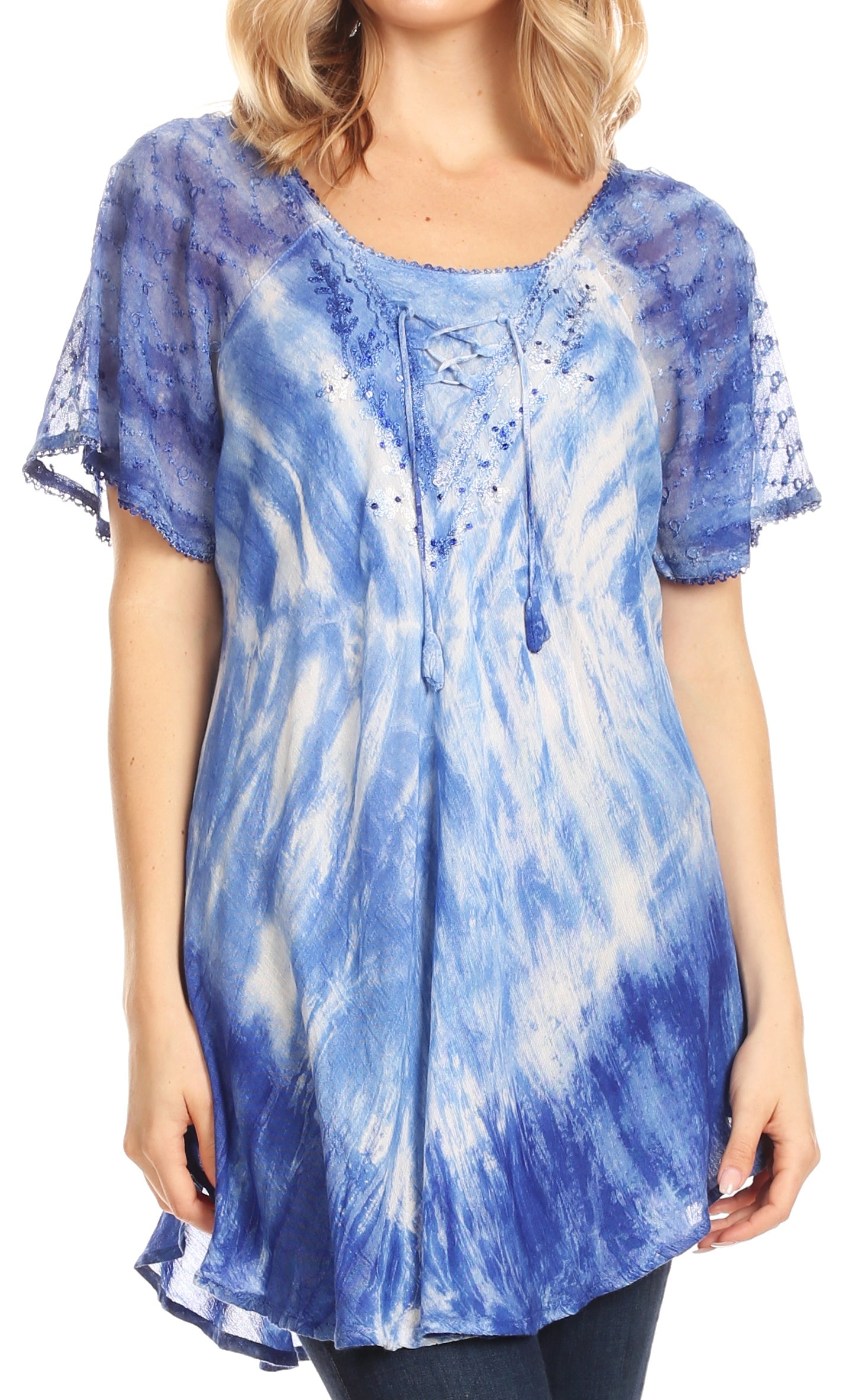 Woman wearing a blue and white tie-dye shirt with lace sleeves.