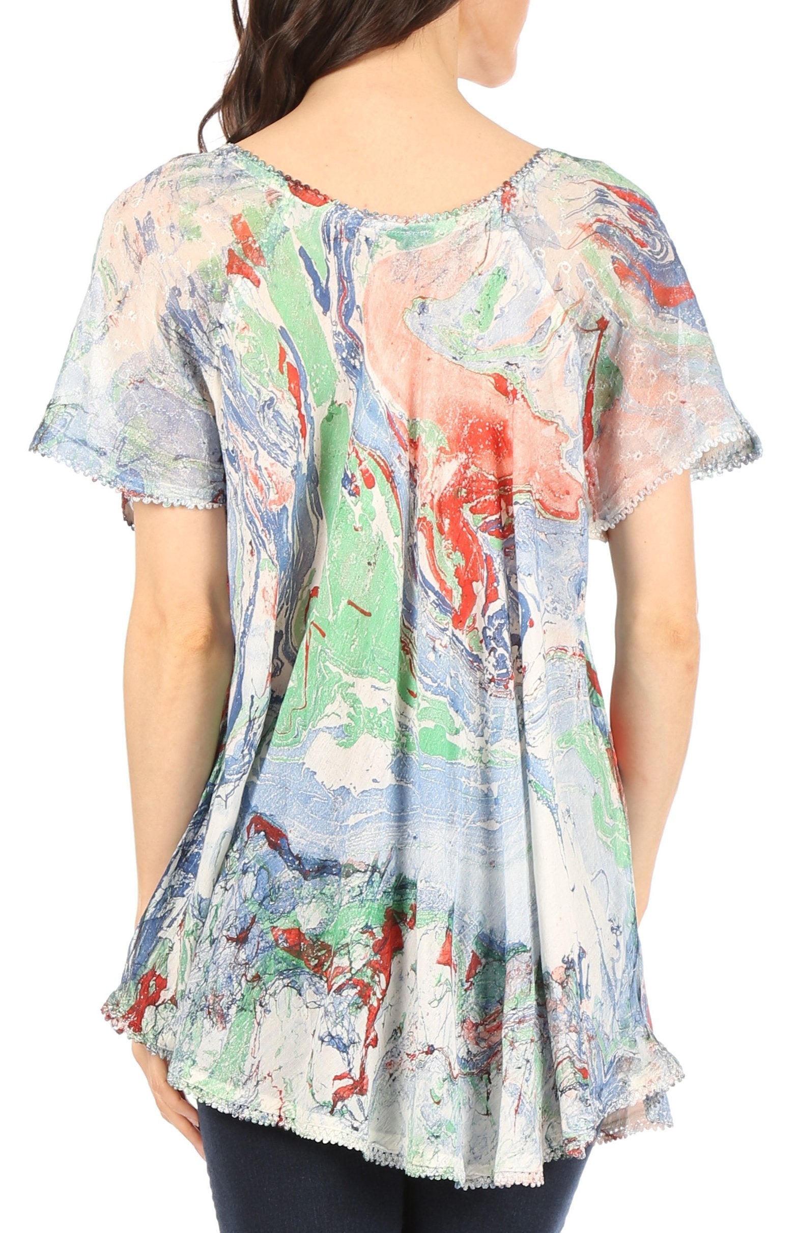 Woman wearing a colorful floral-patterned dress on a white background