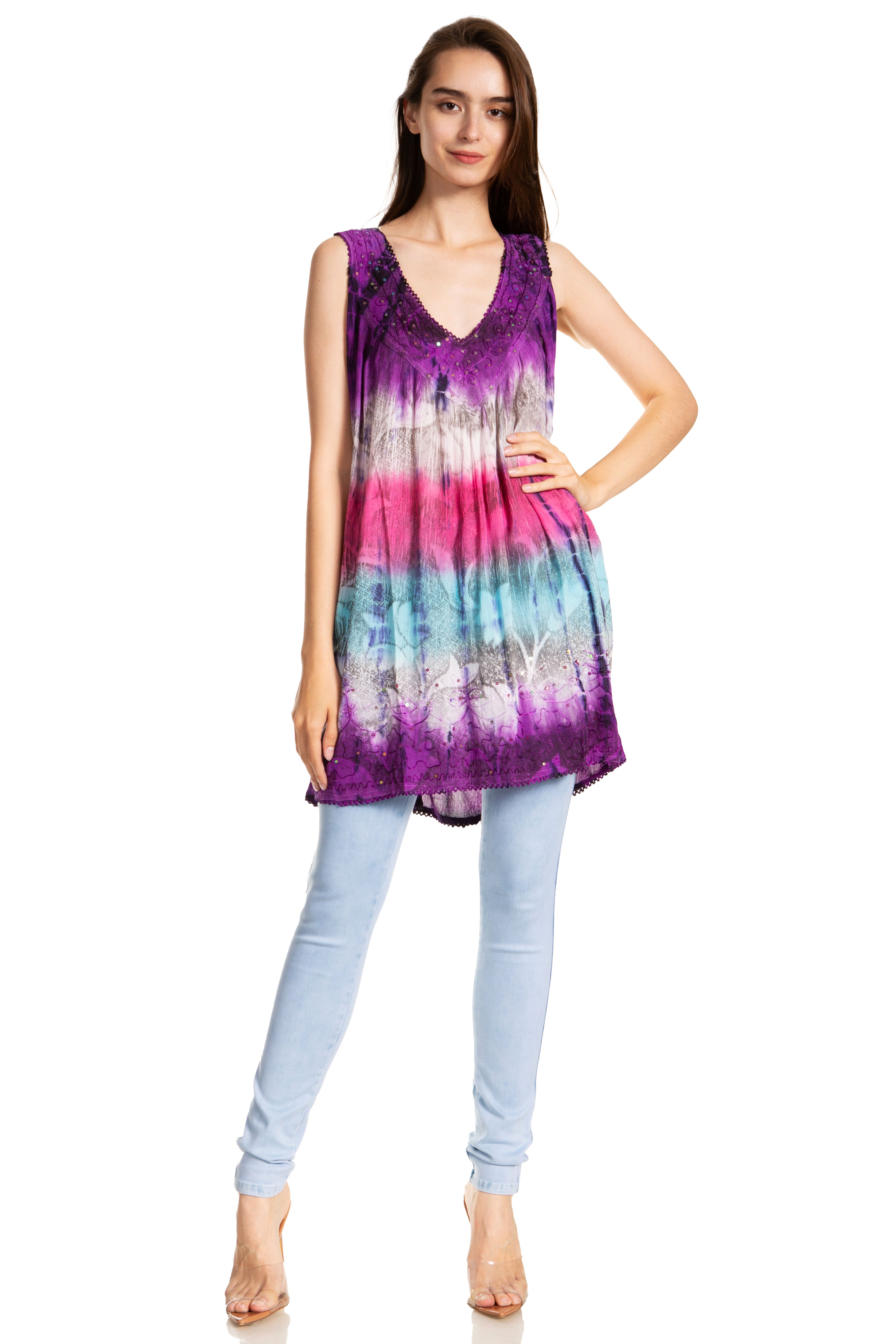 Woman wearing a tie-dye dress with a gradient of purple, pink, and blue on a white background.