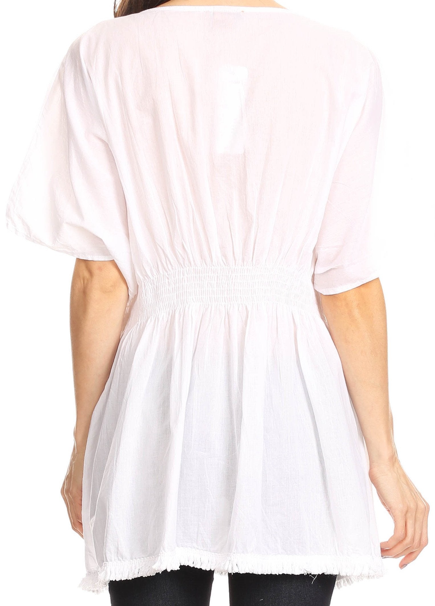 White tunic worn by a person on a white background