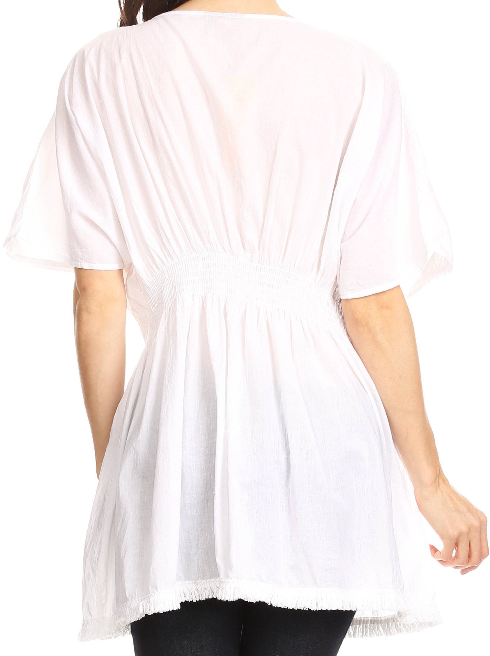 White tunic worn by a person on a white background