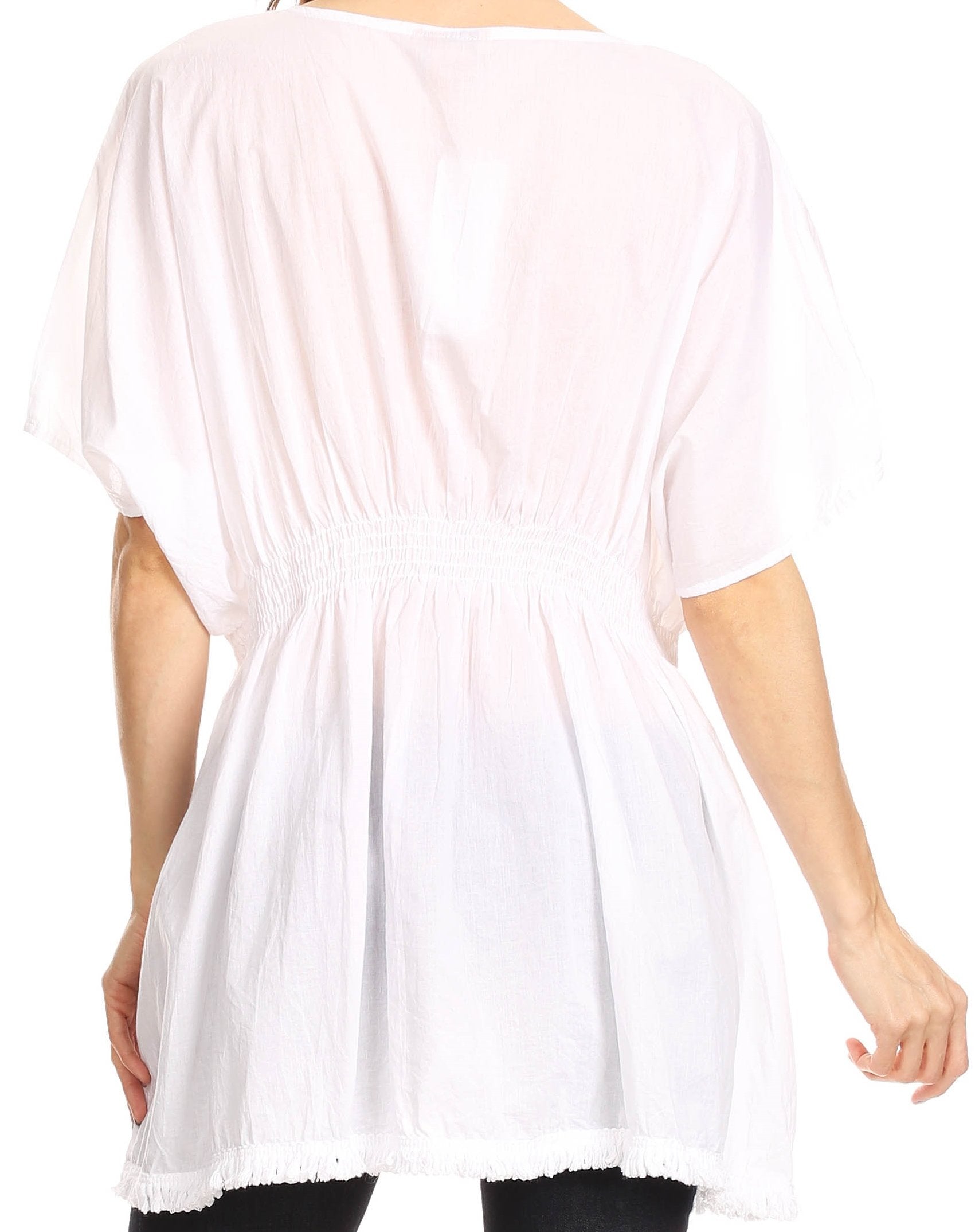 White tunic worn by a person on a white background