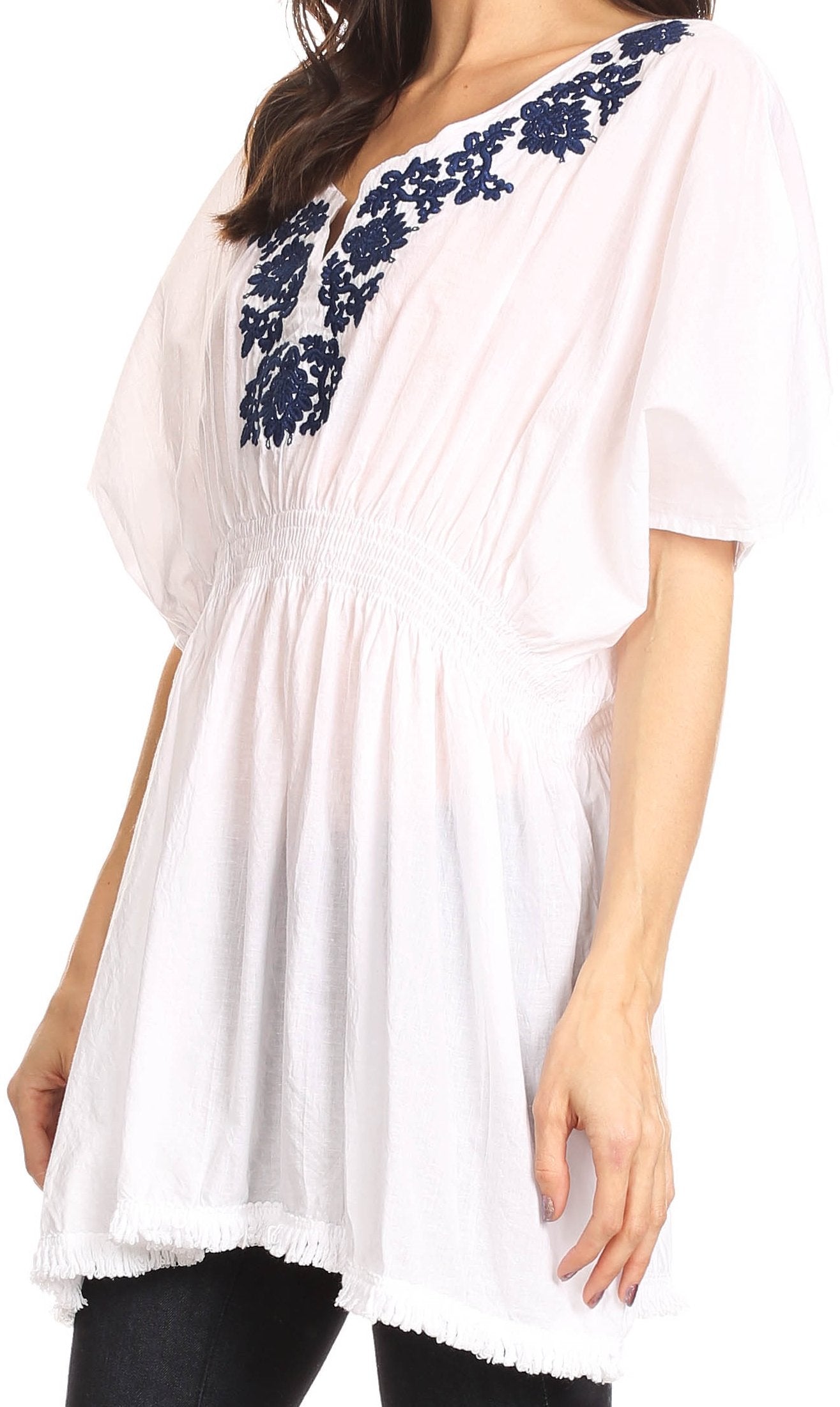 White blouse with blue floral embroidery on a white background