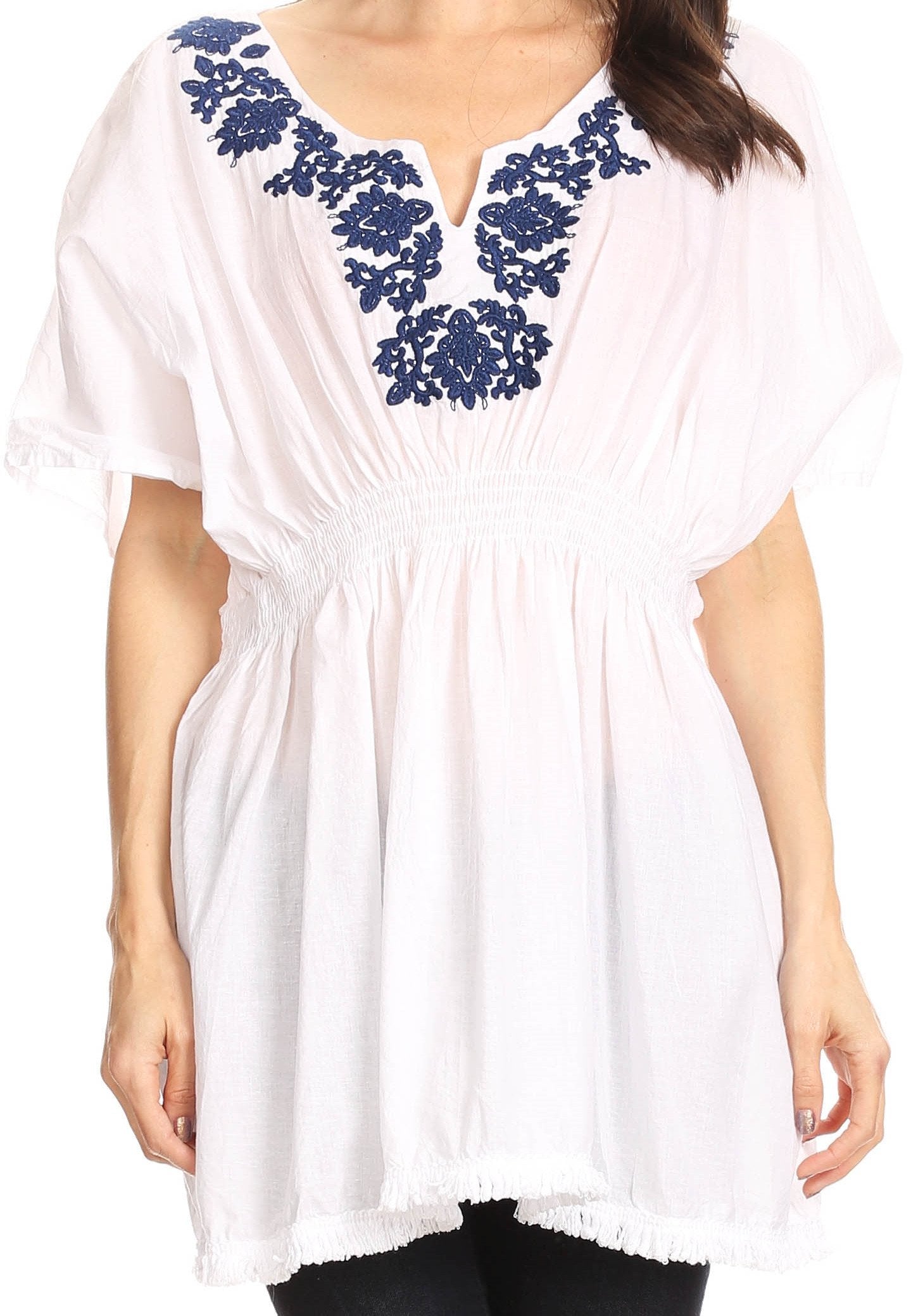 White blouse with blue embroidery on a white background