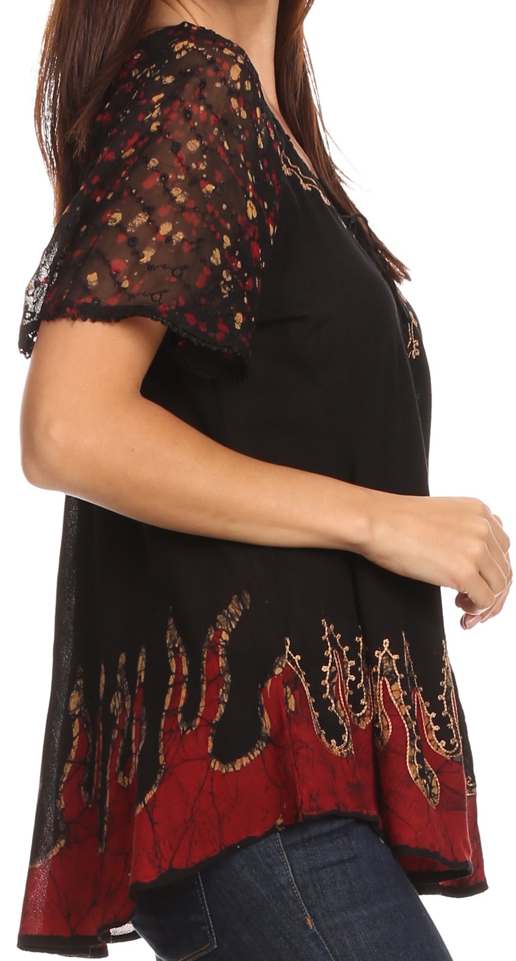 Black and red patterned top worn by a person on a white background