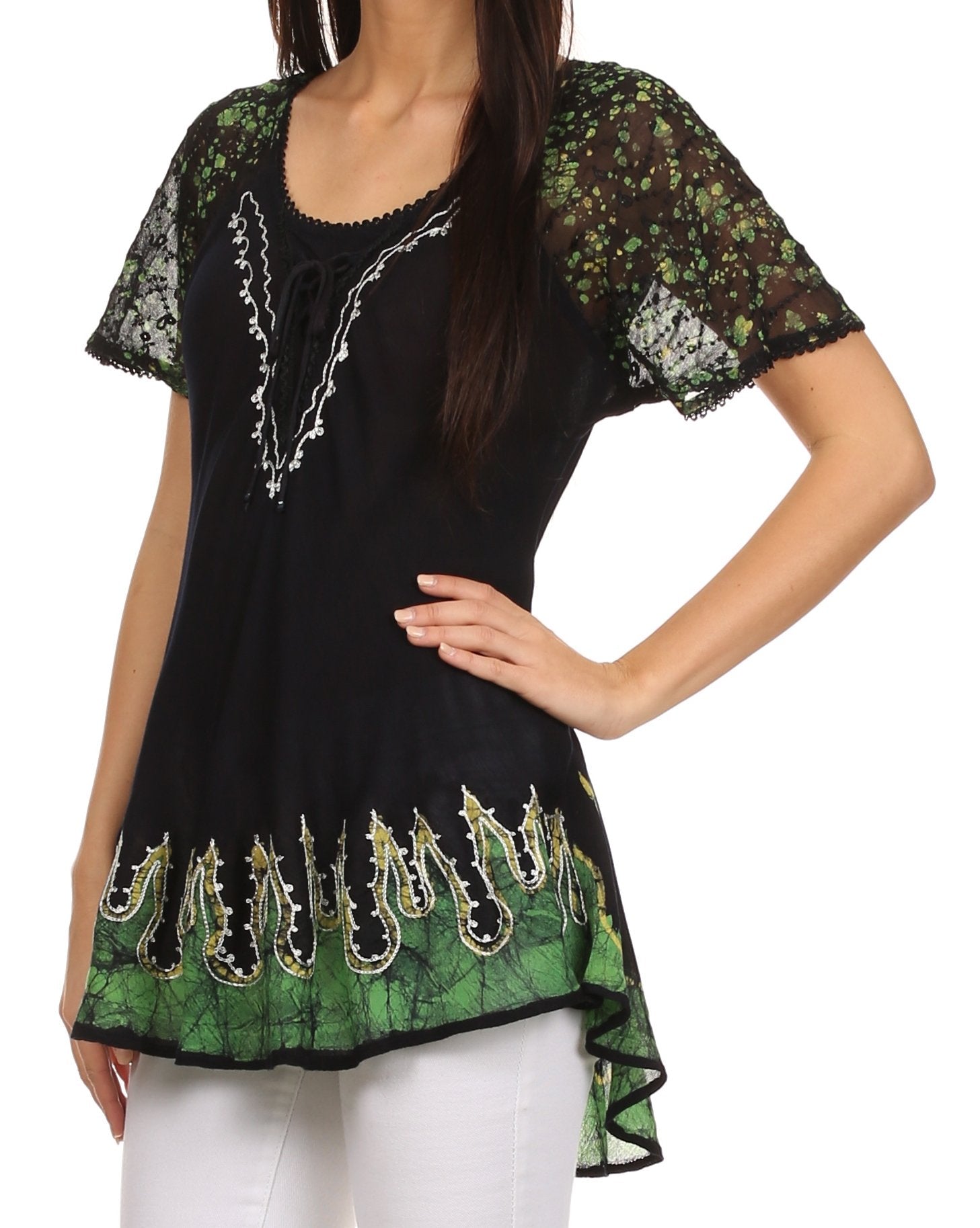 Black and green patterned top worn by a model on a white background