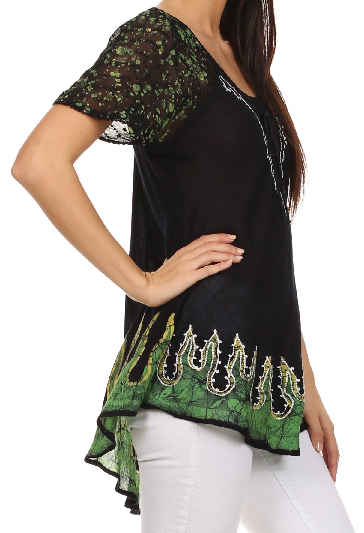 Black top with green leaf pattern and white pants on a white background