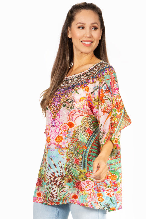 Woman wearing a colorful floral dress on a white background
