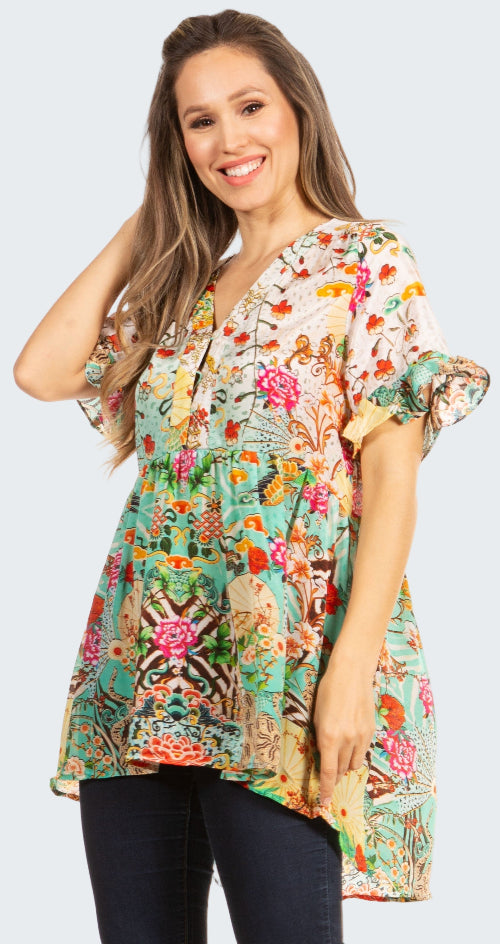 Woman wearing a colorful floral blouse on a white background