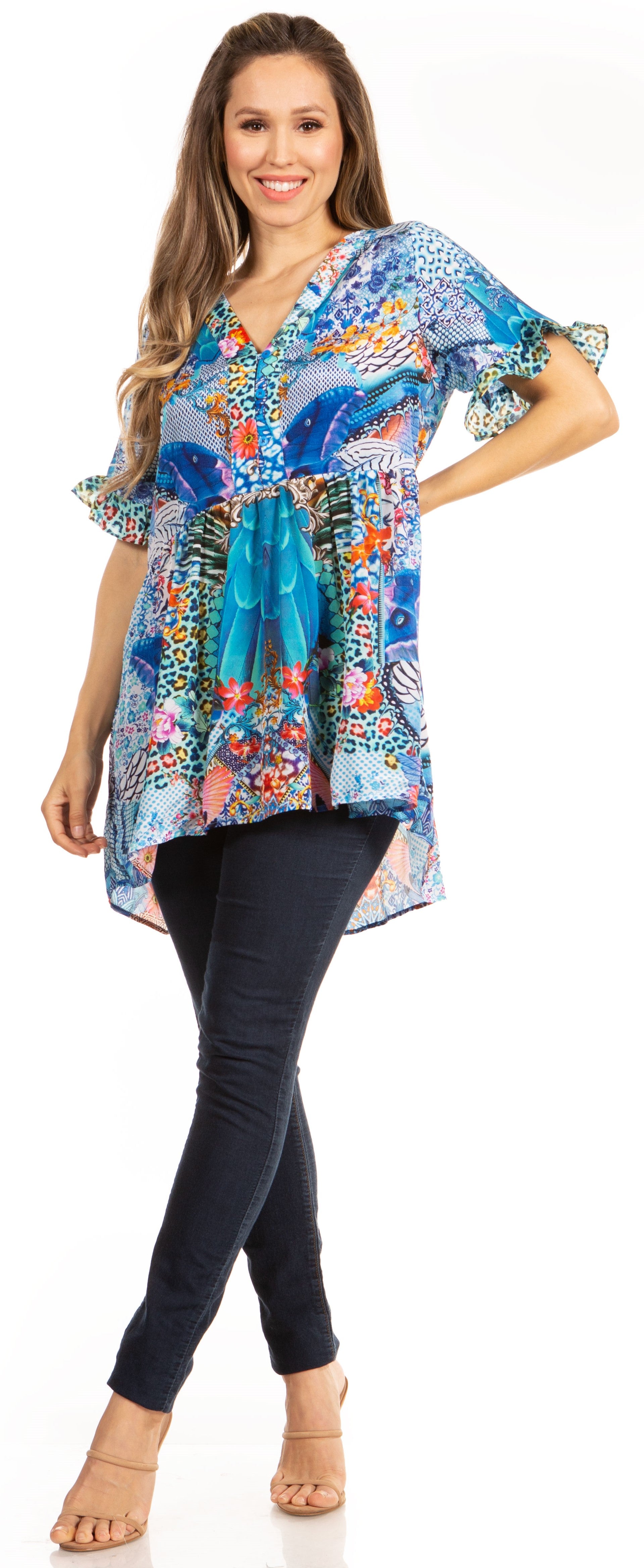 Woman wearing a colorful floral blouse and black pants on a white background