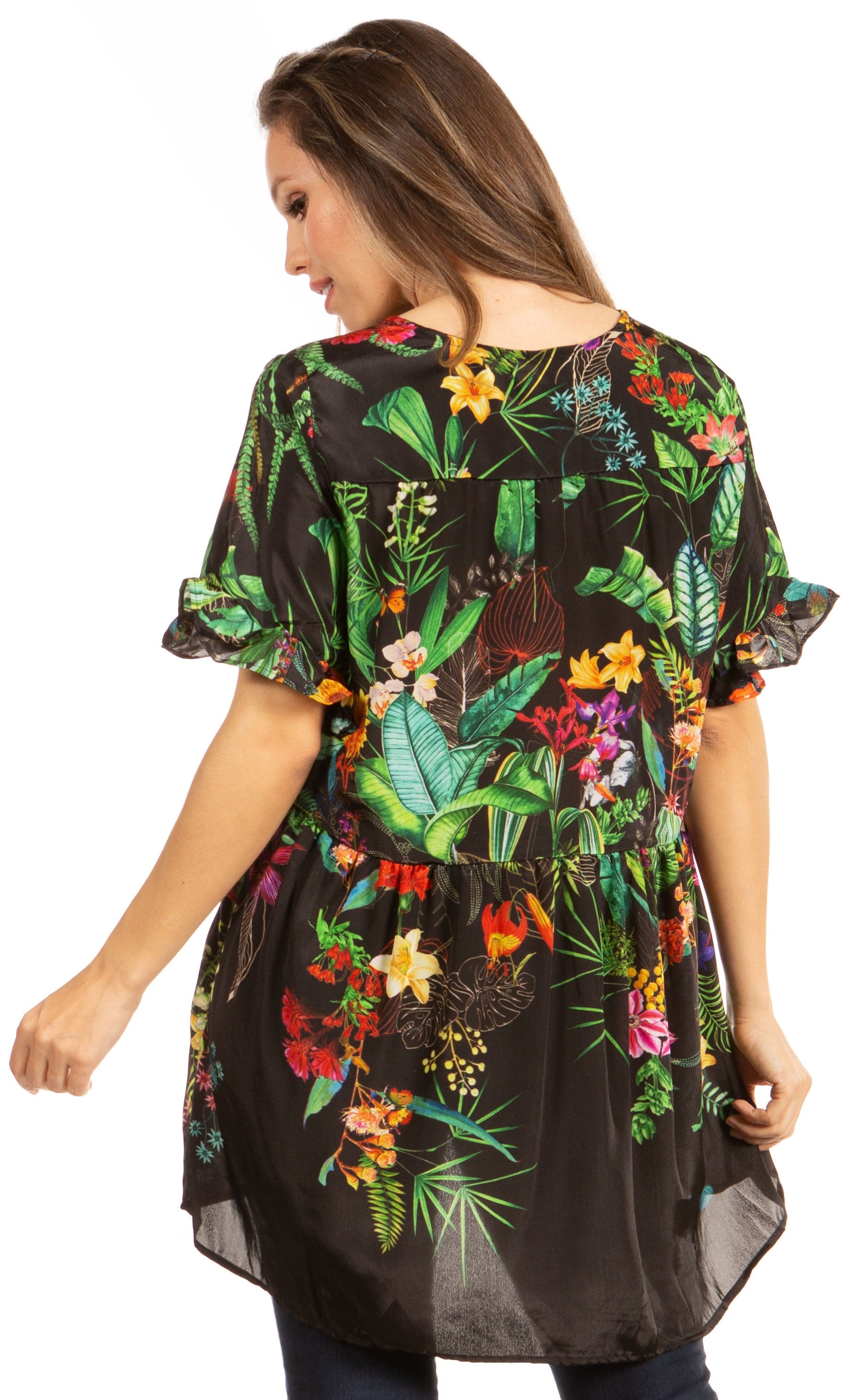 Woman wearing a black floral blouse with colorful flowers on a white background