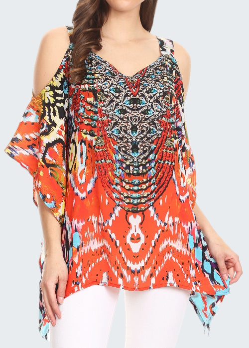 Woman wearing a colorful patterned top with a white background