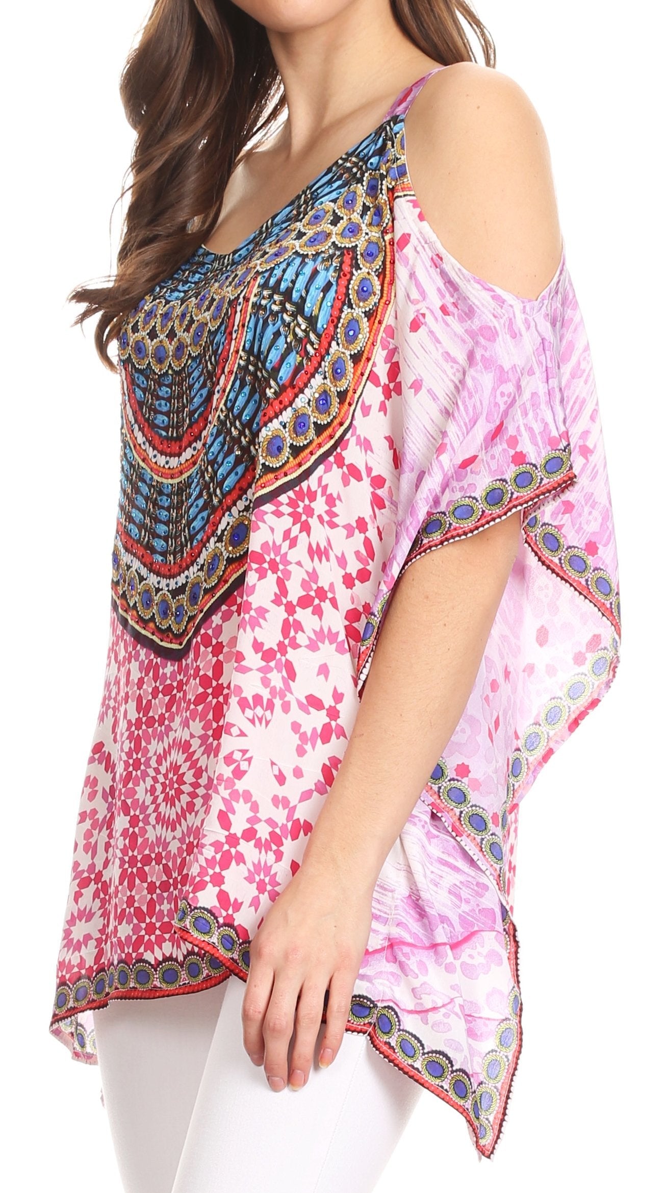 Colorful floral and patterned top worn by a model on a white background