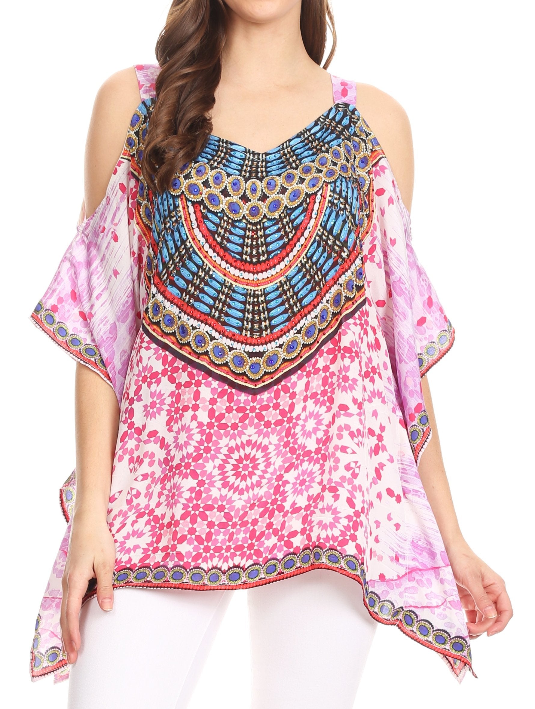 Woman wearing a colorful blouse with a pink floral pattern and decorative elements.