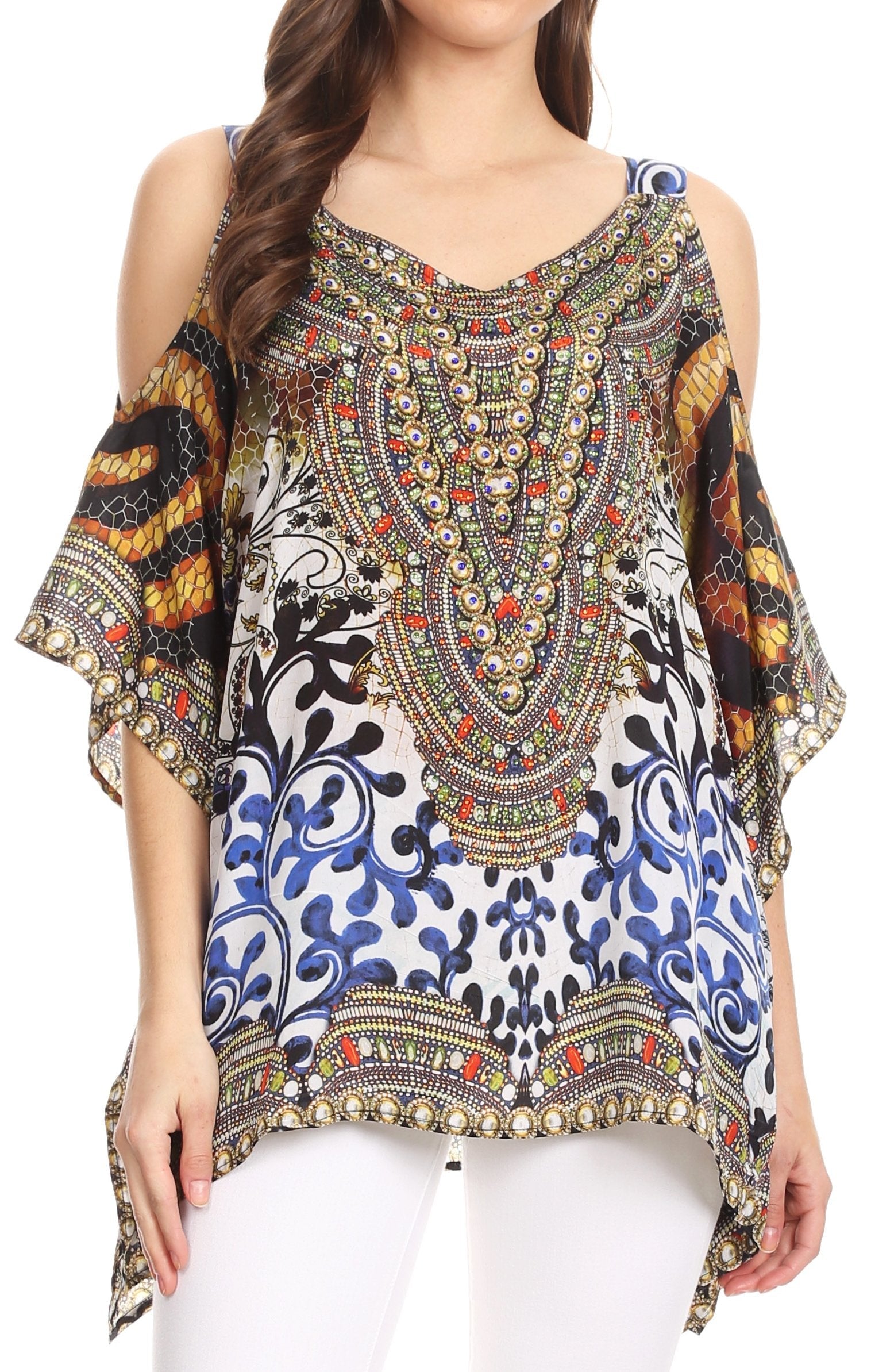 Woman wearing a colorful patterned top with embellishments on a white background