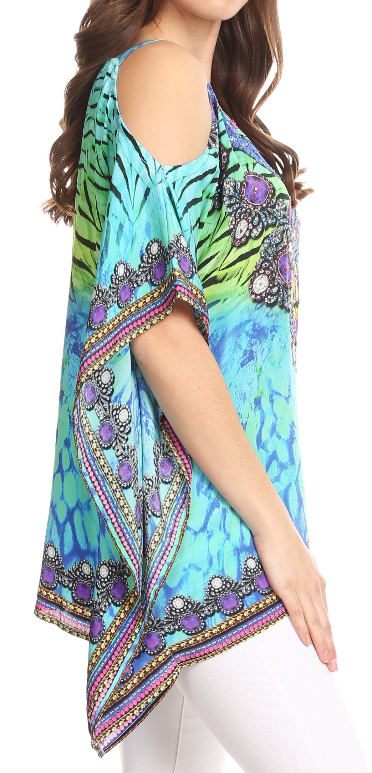 Woman wearing a colorful patterned top with a white background