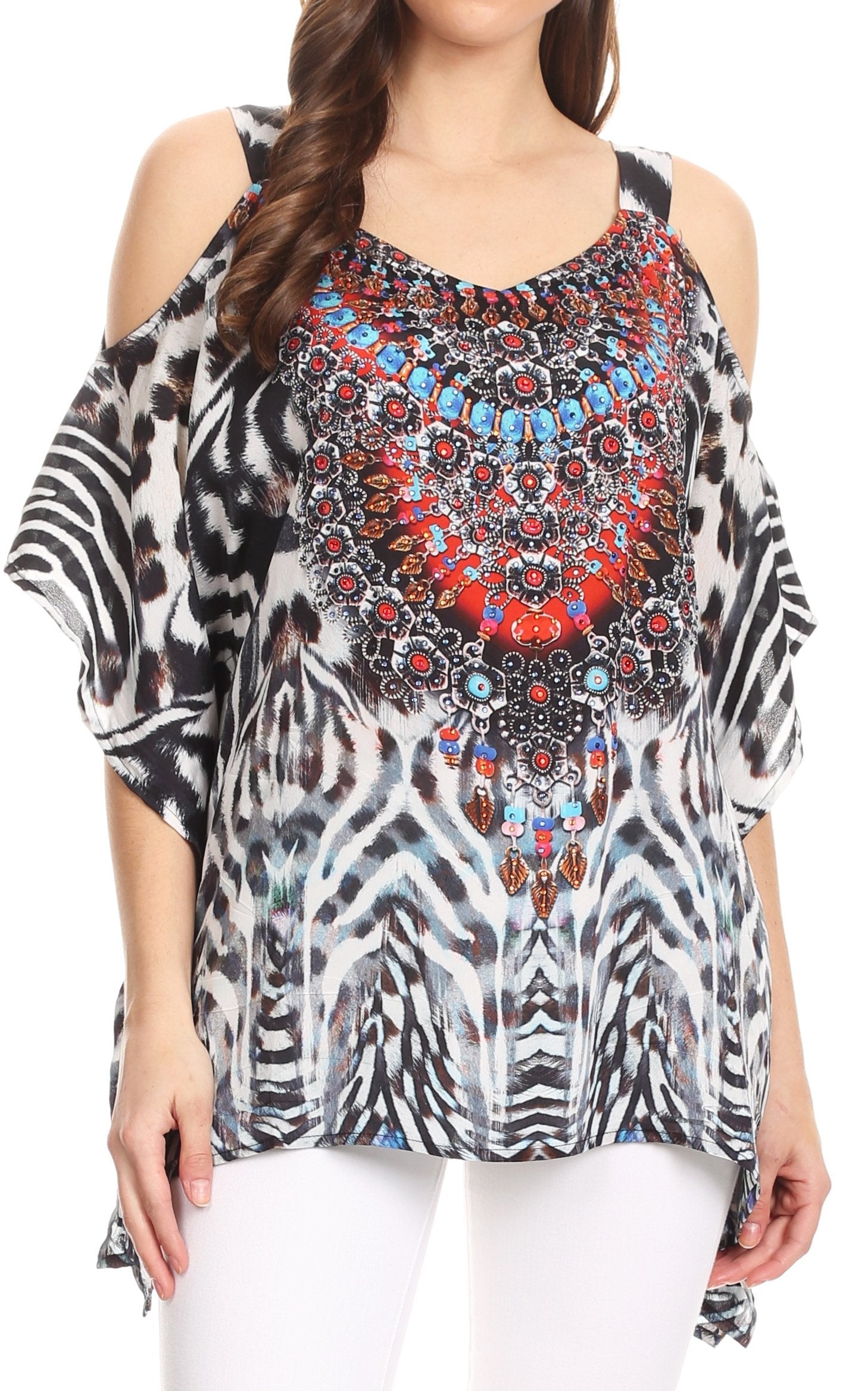 Woman wearing a patterned top with a colorful central design