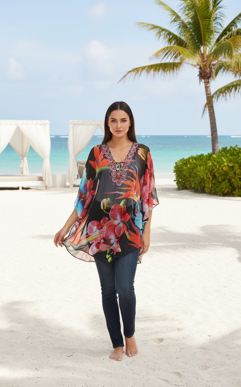 Woman wearing a colorful floral blouse with intricate details