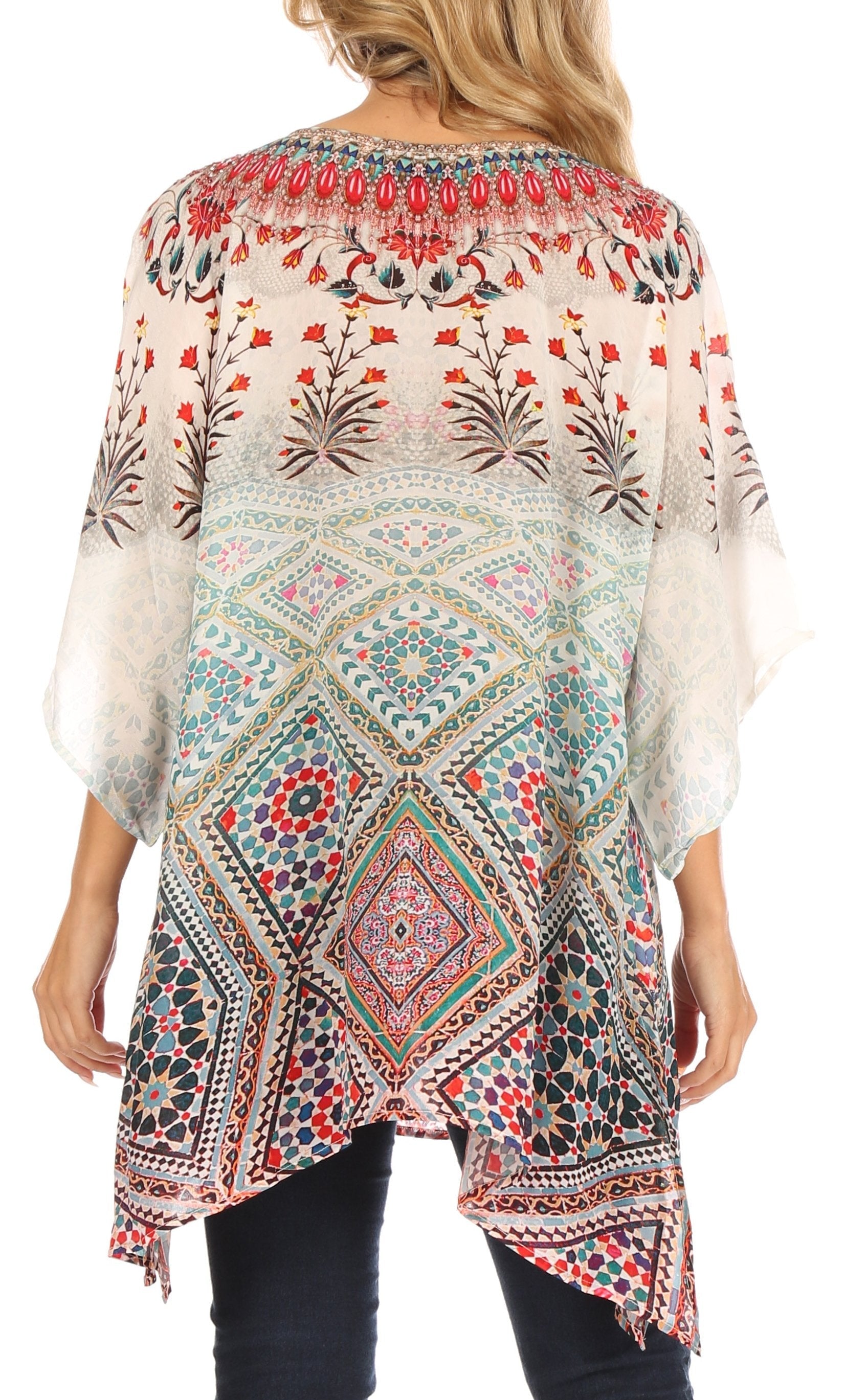 Woman wearing a colorful patterned kimono-style top on a white background