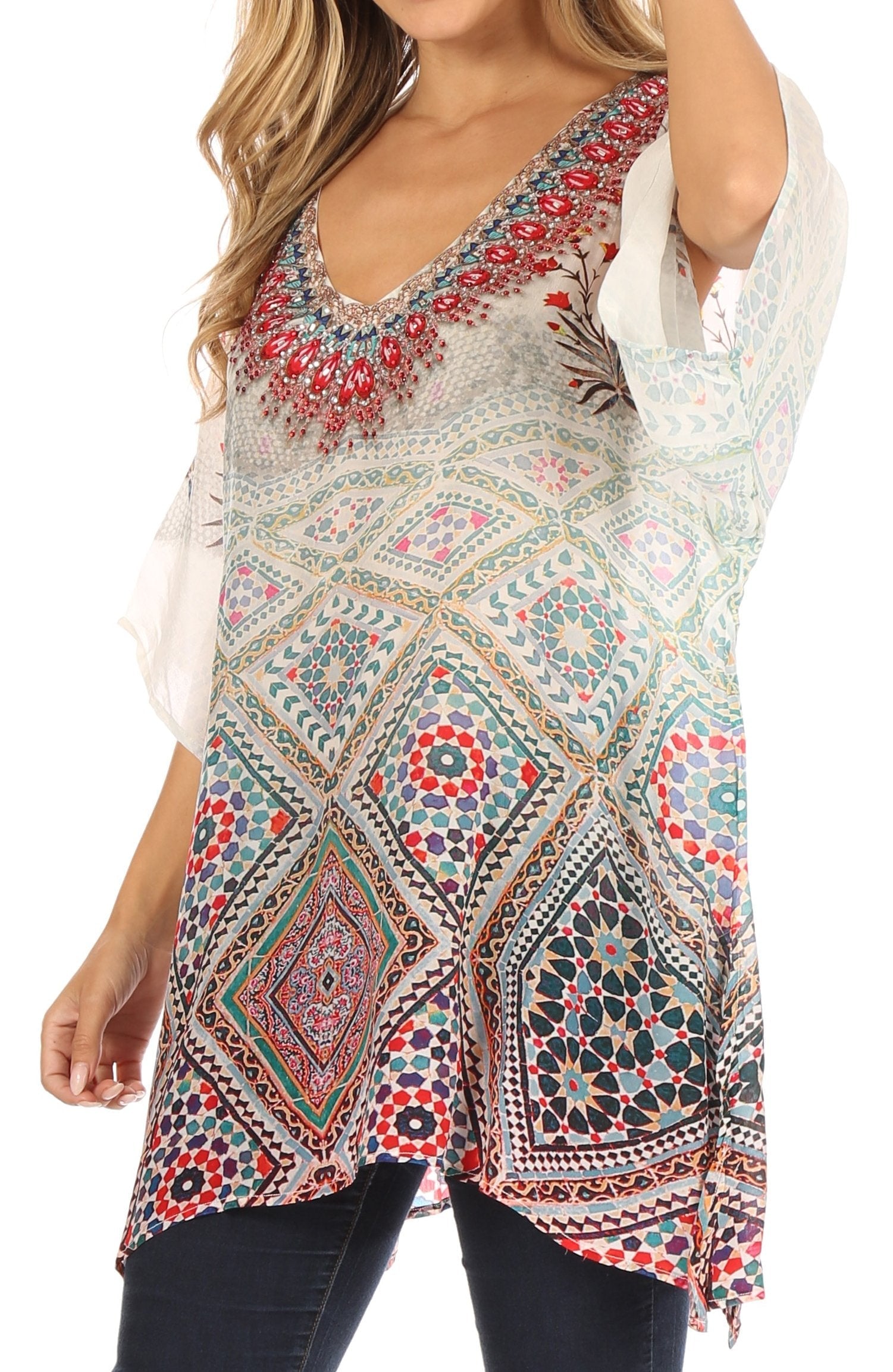 Woman wearing a colorful patterned top with a white background