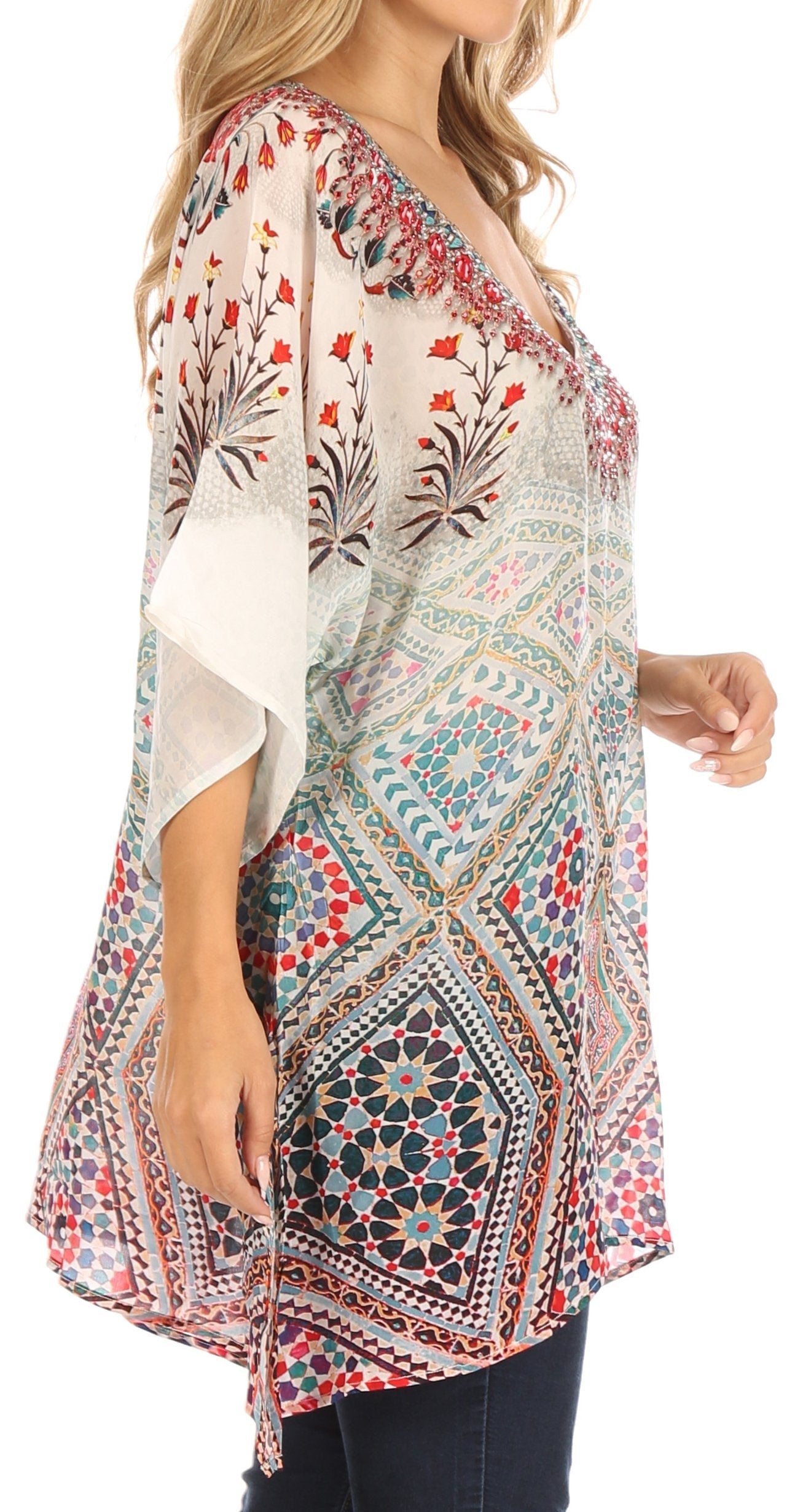 Woman wearing a patterned kimono-style top on a white background