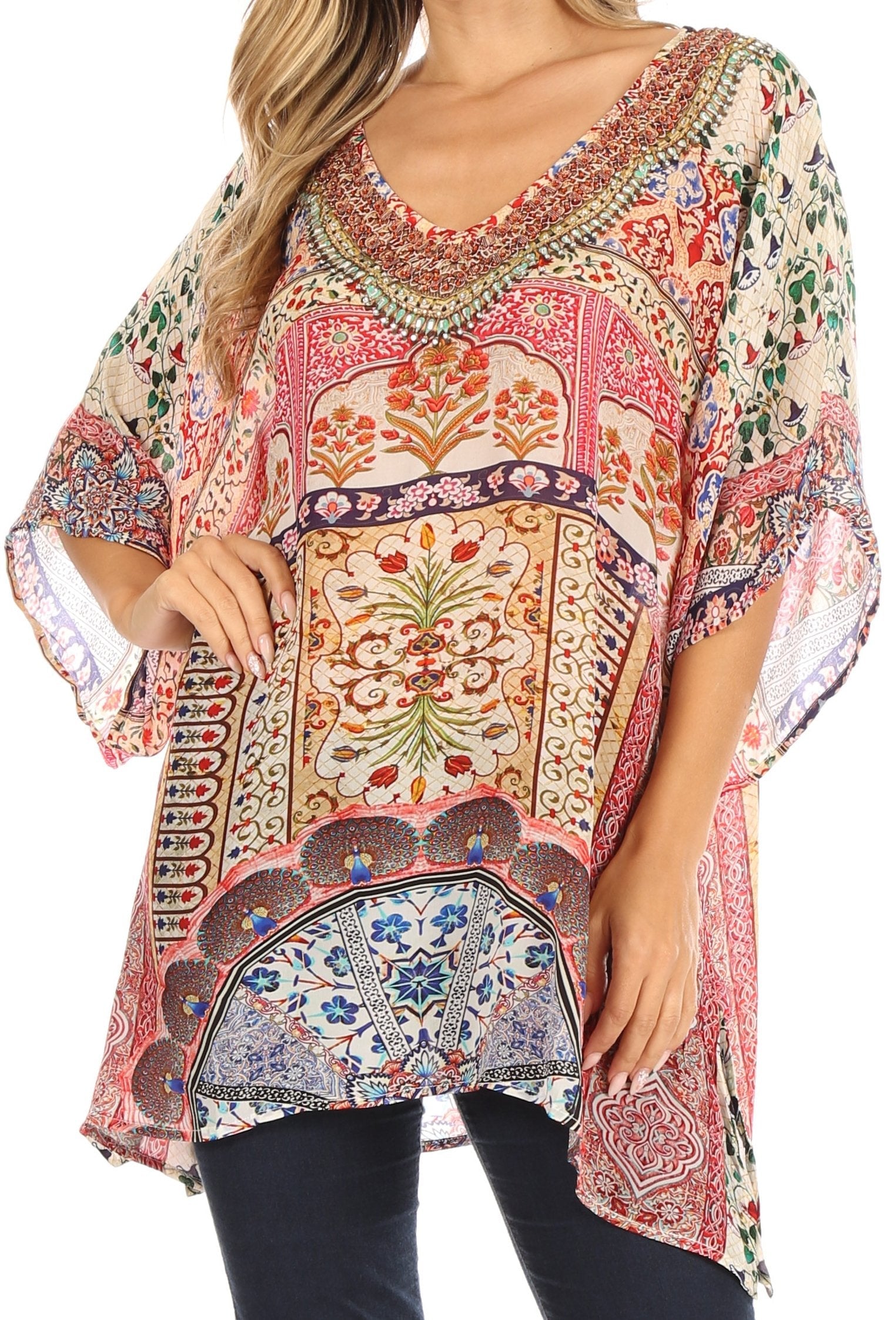 Colorful patterned blouse worn by a person on a white background