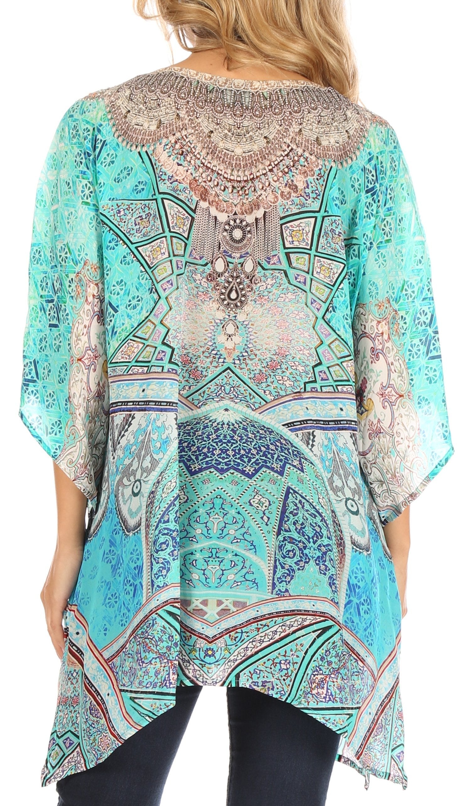 Woman wearing a colorful patterned top with a white background