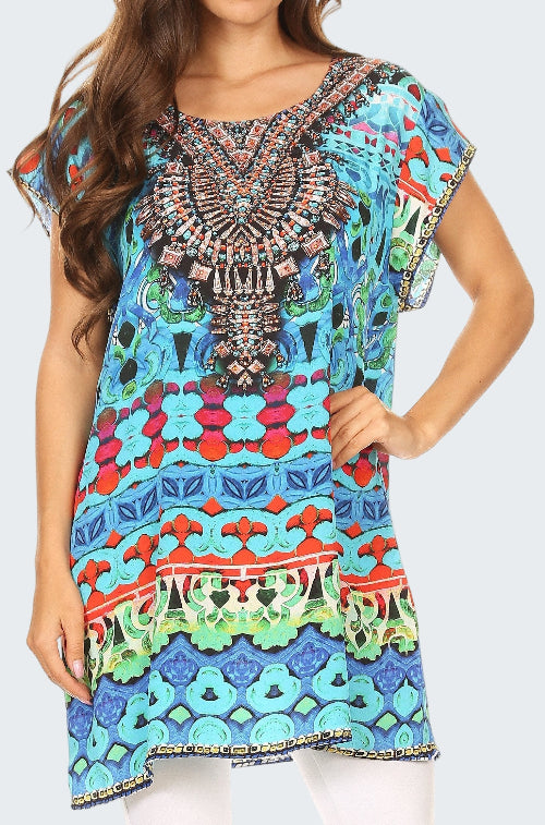 Woman wearing a colorful patterned dress with intricate designs.